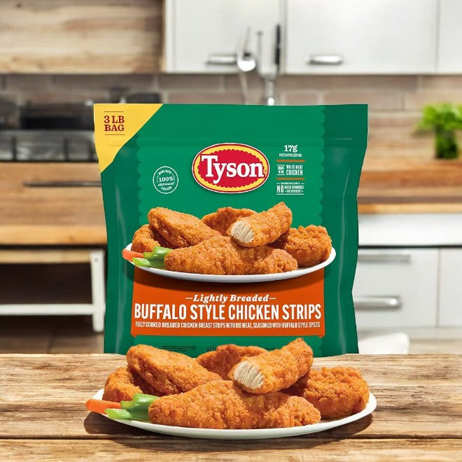 A 3-pound frozen case of Tyson Buffalo Style Chicken Strips, presented on a plate in a kitchen setting and coated in tangy buffalo sauce, makes for the perfect spicy snack.