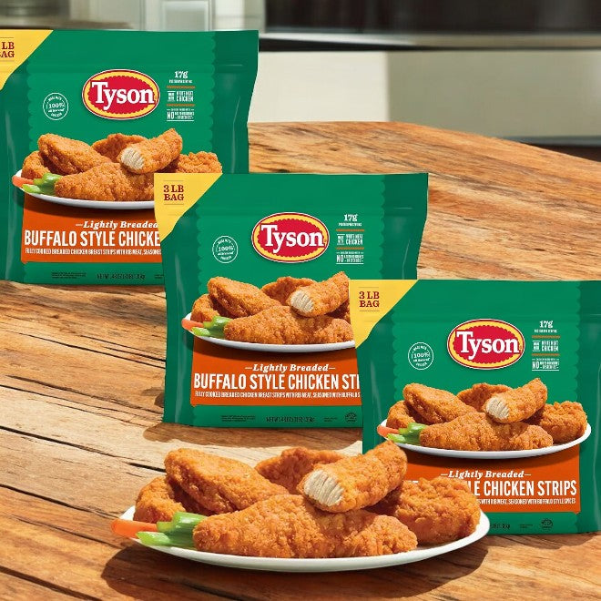 Three packages of Tyson Buffalo Style Chicken Strips, Frozen, 3 pounds each, are shown on a wooden surface. Each package features a plate of chicken strips with carrot and celery sticks, paired perfectly with tangy buffalo sauce.