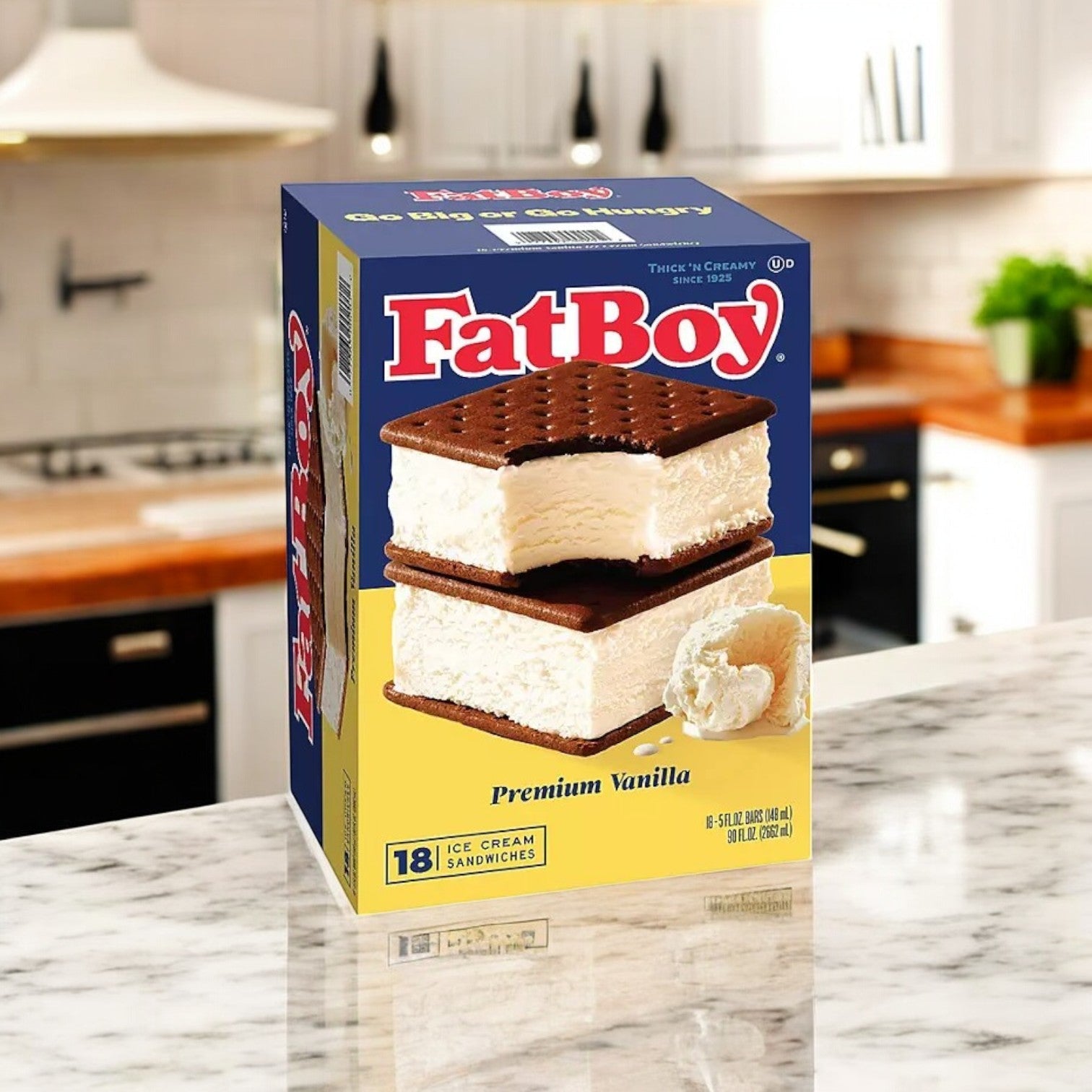 A box of FatBoy Smores Sandwich Bars, 12 Count, sits on a marble kitchen counter, featuring an image of two sandwiches on the front—perfect for your next Sam’s Club haul.