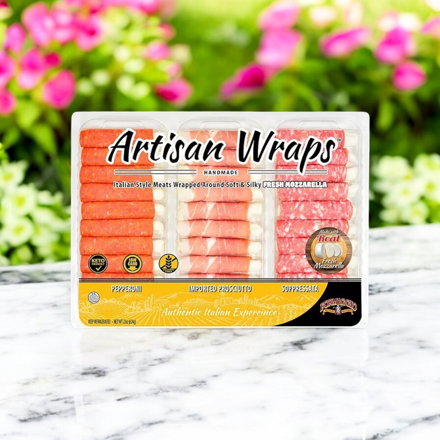 A 22 oz. package of Formaggio Cheese Artisan Meat & Mozzarella Variety Wraps elegantly displayed on a marble surface with a blurred floral background.