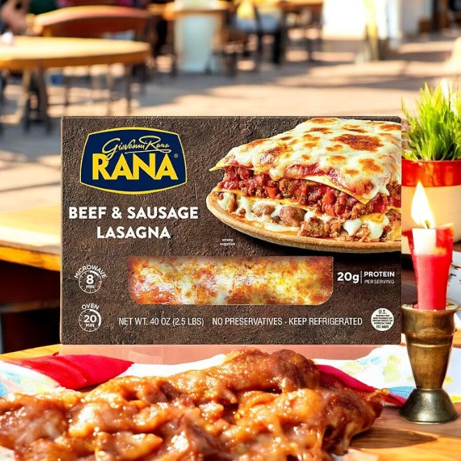A box of Giovanni Rana Beef and Sausage Lasagna 40 oz rests on an outdoor table, creating a family-friendly Italian classic meal with a blurred patio and candlelit background.