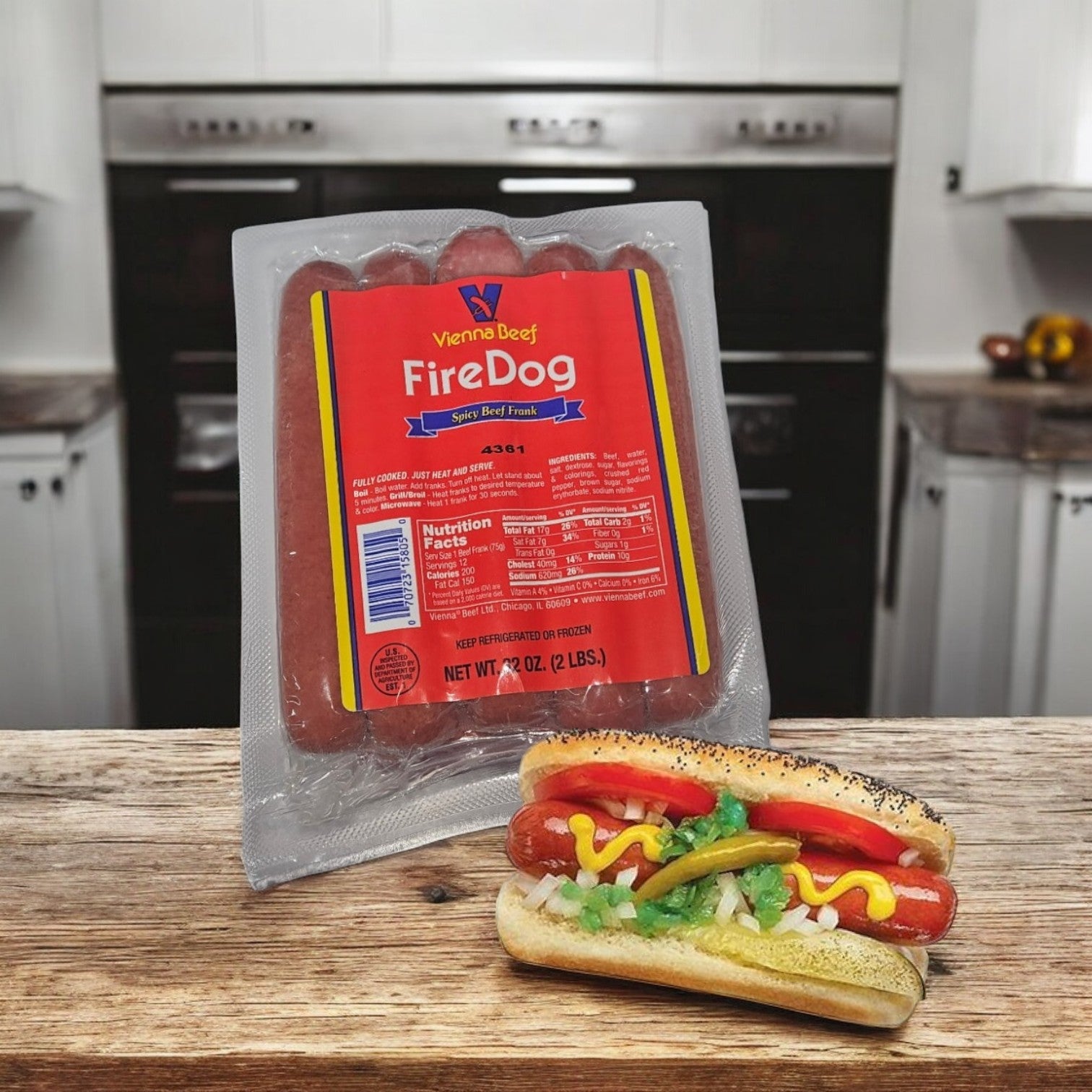 A pack of Vienna Beef Fire Spicy Jumbo Franks - 1 Count (12 Franks Per Pack) by Vienna Beef rests on the counter, while a cooked dog in a poppy seed bun with onions, peppers, mustard, and relish is showcased.