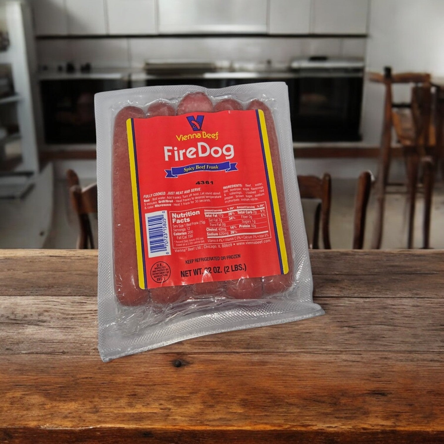 A pack of Vienna Beef Fire Spicy Jumbo Franks (12 franks per pack) sits on a wooden table in the kitchen, ideal for grilling season.
