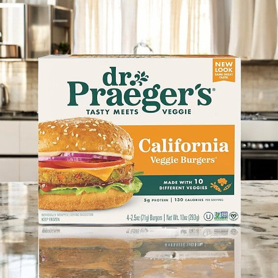 A Dr. Praeger's Burgers Veggie California Burger- 1 Count sits on the counter, boasting "Made with 10 Different Veggies." This plant-based option is a nutritious meatless alternative for those seeking a deliciously healthy choice.