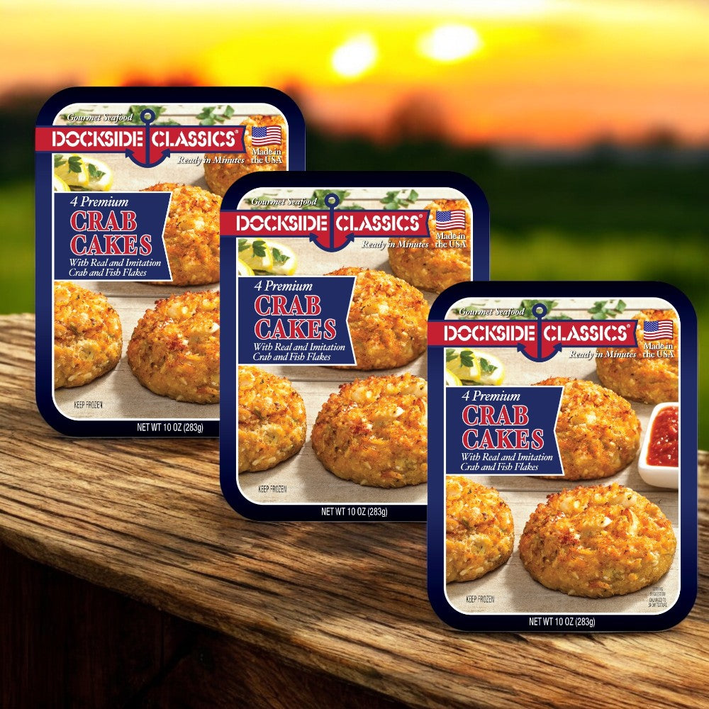 Three boxes of Dockside Classics Gourmet Crab Cakes, each 10 oz., are displayed. Ideal for seafood enthusiasts, each box contains four crab cakes made with premium ingredients and features an enticing image beside a savory dipping sauce.