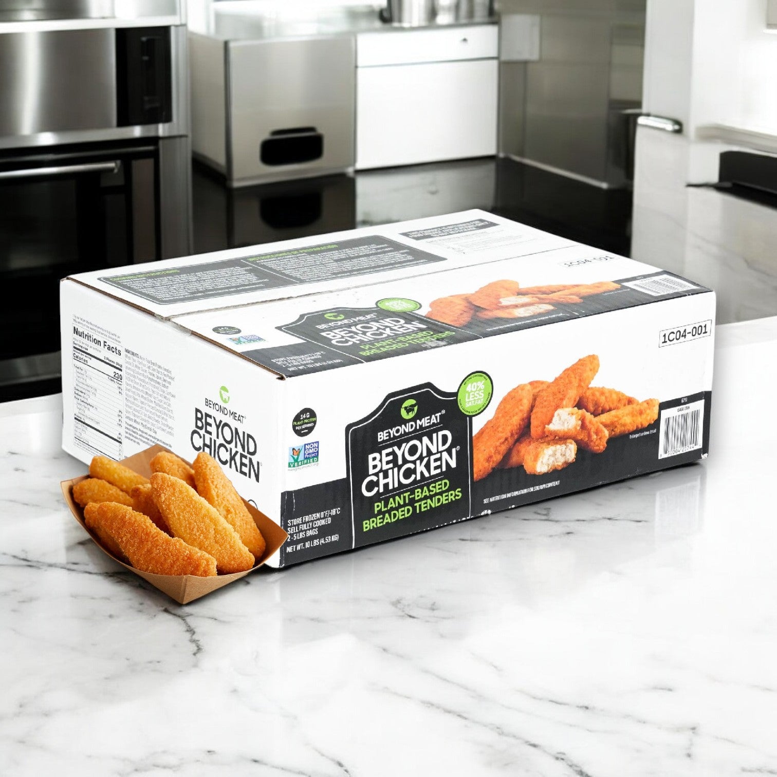 Box of Beyond Meat Plant-Based Chicken Tenders, cruelty-free and breaded, on a marble kitchen countertop.