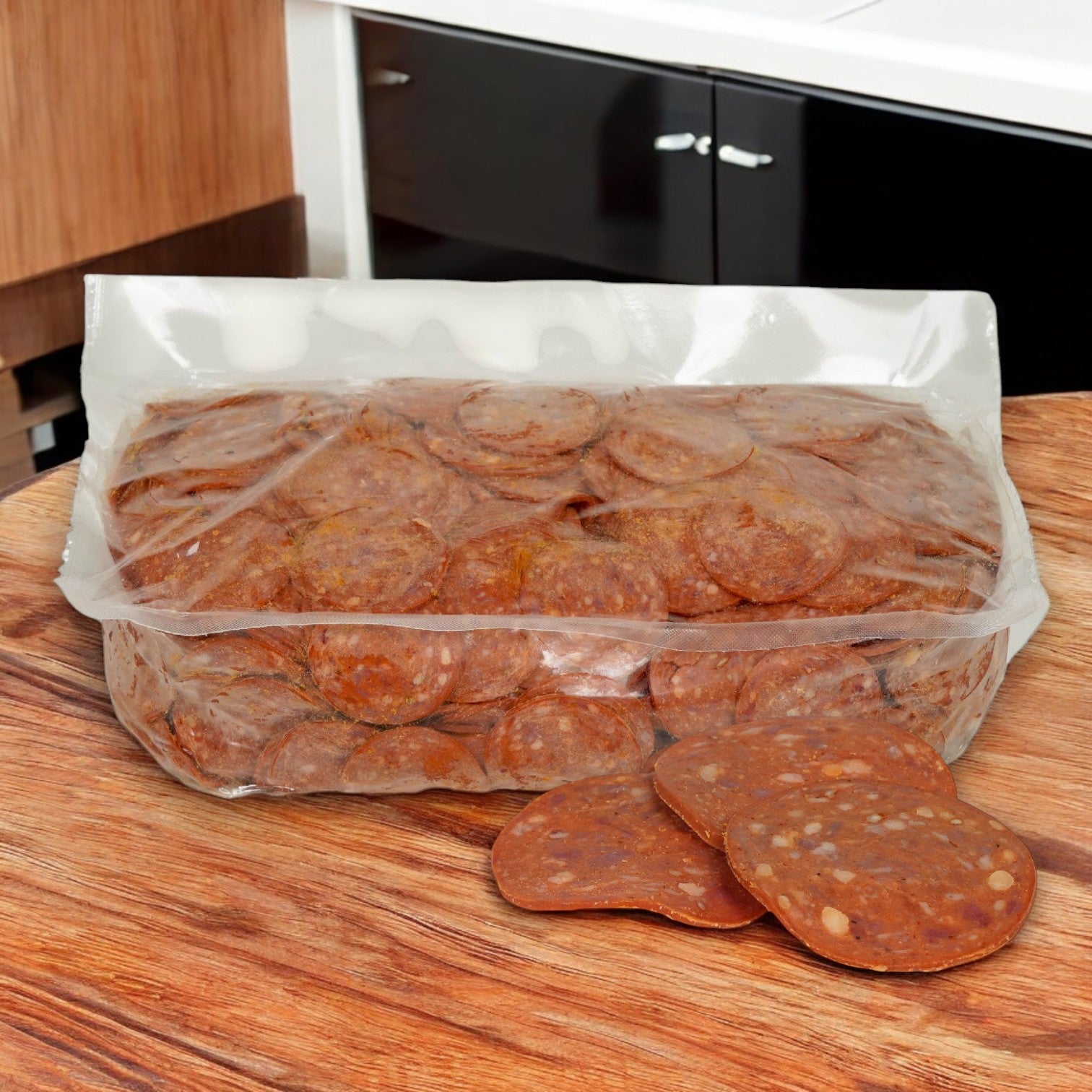 A large, partially opened bag of Greco & Sons Beef Sliced Pepperoni Halal (2/5 LB) sits on a wooden countertop with slices scattered in front. Kitchen cabinets and a countertop are visible, promising flavorful, halal-certified goodness for your gatherings.