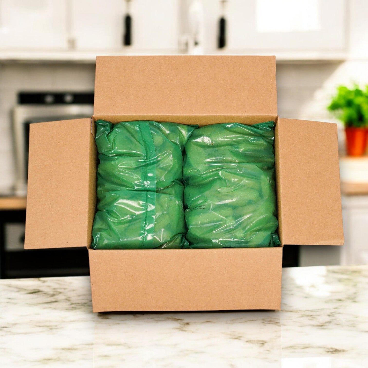 On a marble countertop, an open box displays two sealed bags of Beyond Meat Plant-Based Chicken Tenders, emphasizing a vegan and cruelty-free lifestyle in the kitchen setting.