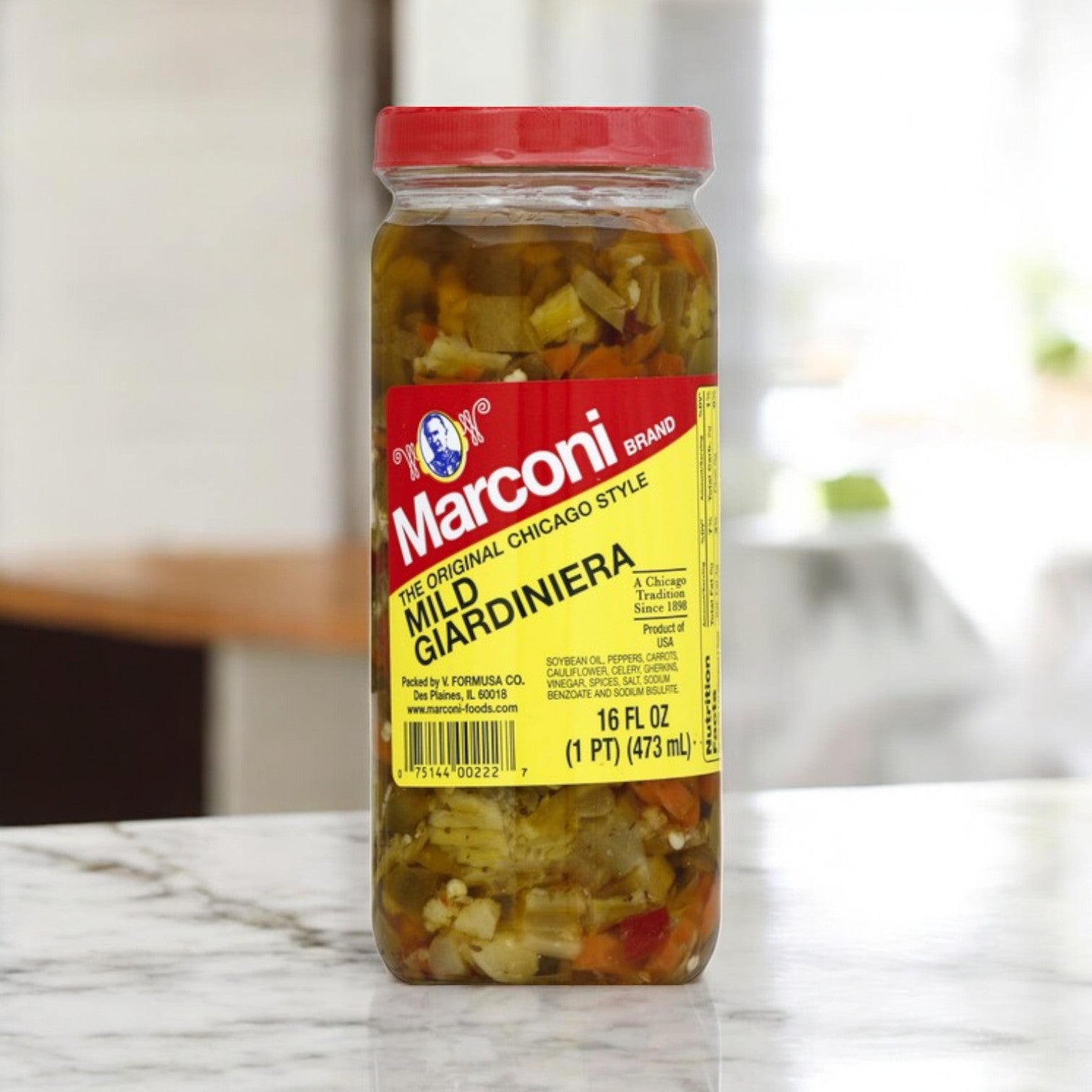 A jar of giardiniera from the Papa Charlies 32 Sandwich Combo!! sits on the marble countertop, perfect for topping a hearty roast beef sandwich or adding a zesty crunch to fresh hoagie rolls.