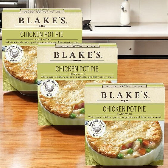Three boxes of Blake’s Chicken Pot Pie-3 Count are displayed on a wooden surface, each featuring a picture of savory pot pie with vegetables and flaky pastry—a classic comfort meal from Blake's made with natural ingredients.