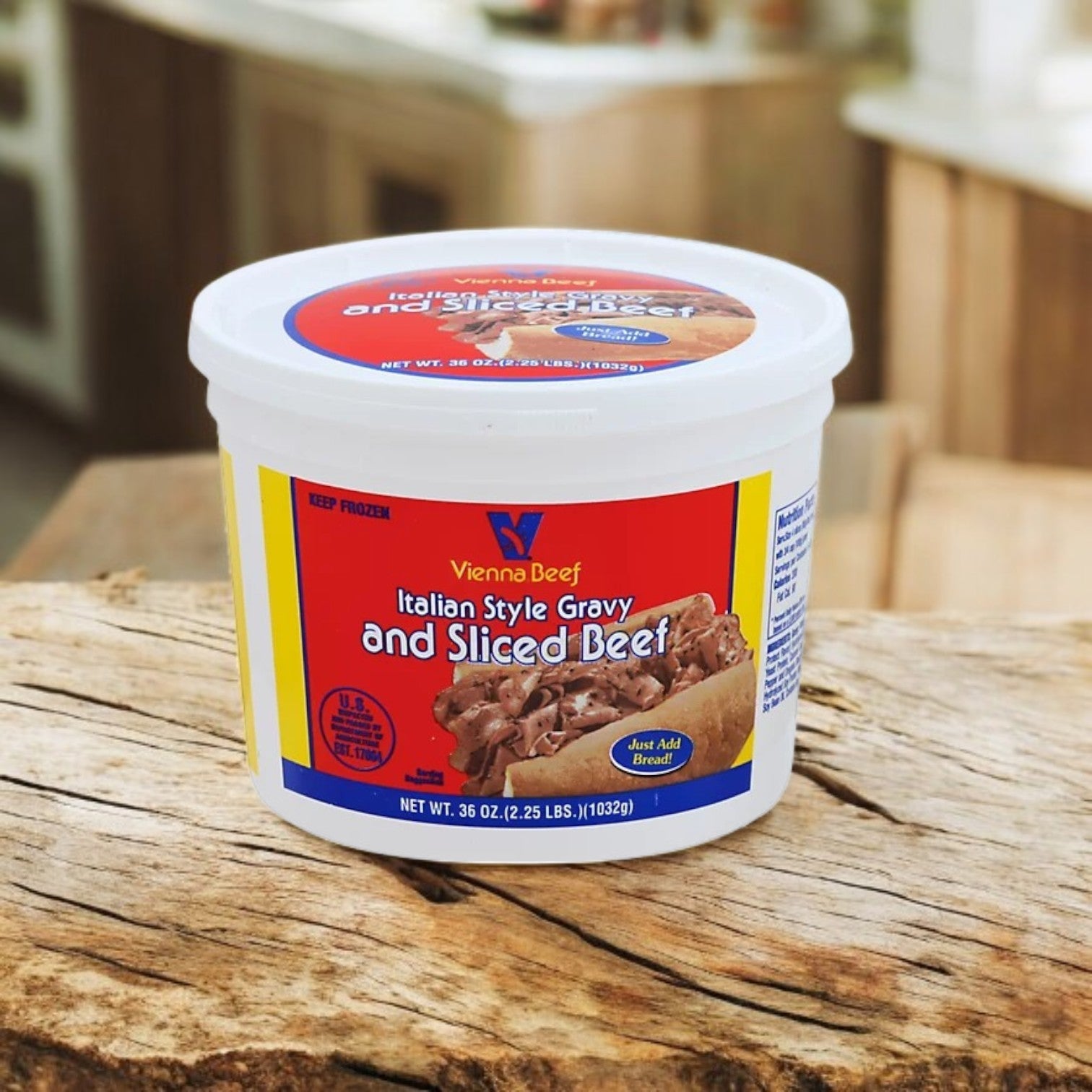 A tub of Vienna Beef's Italian Style Gravy and Sliced Beef, a signature ingredient for Chicago-style Italian beef sandwiches, sits on a wooden table. It is adorned with a colorful label that showcases the delicious contents.