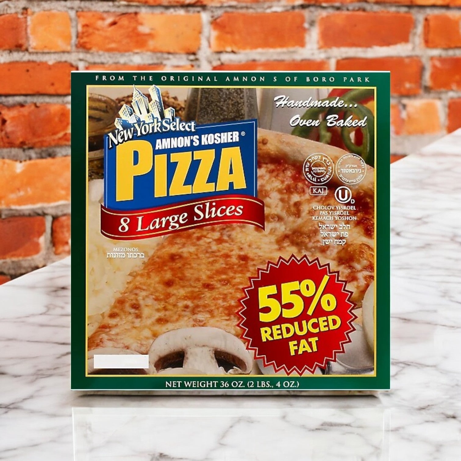 Amnon's Kosher Pizza 55% Reduced Fat Frozen, 36 oz. - 3 Count offers a healthier pizza option with 8 large slices, set against a white wooden surface and brick wall backdrop.