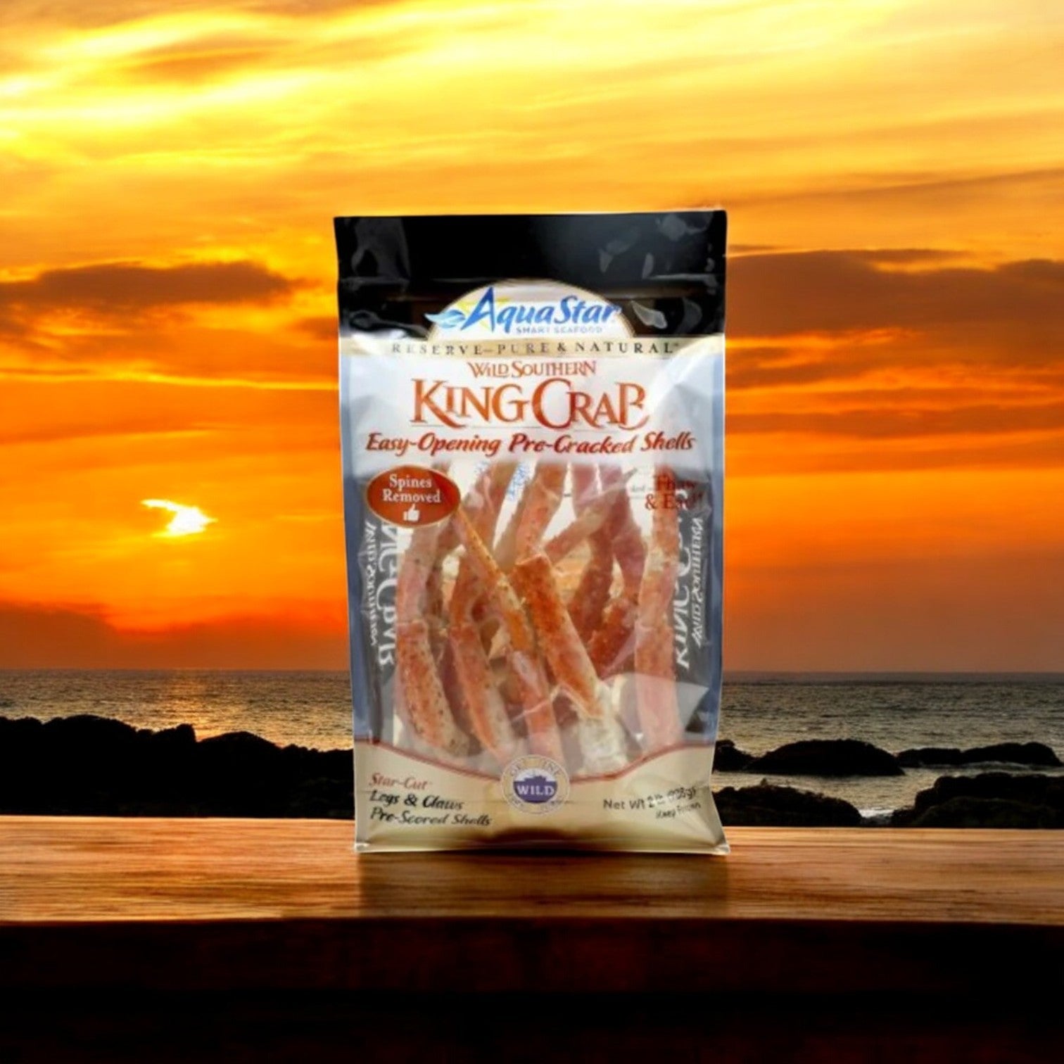 A Crab and Lobster 2 Pack Seafood Feast Combo from Easy Lunches graces the table, creating the perfect setting as the sun sets over the ocean.