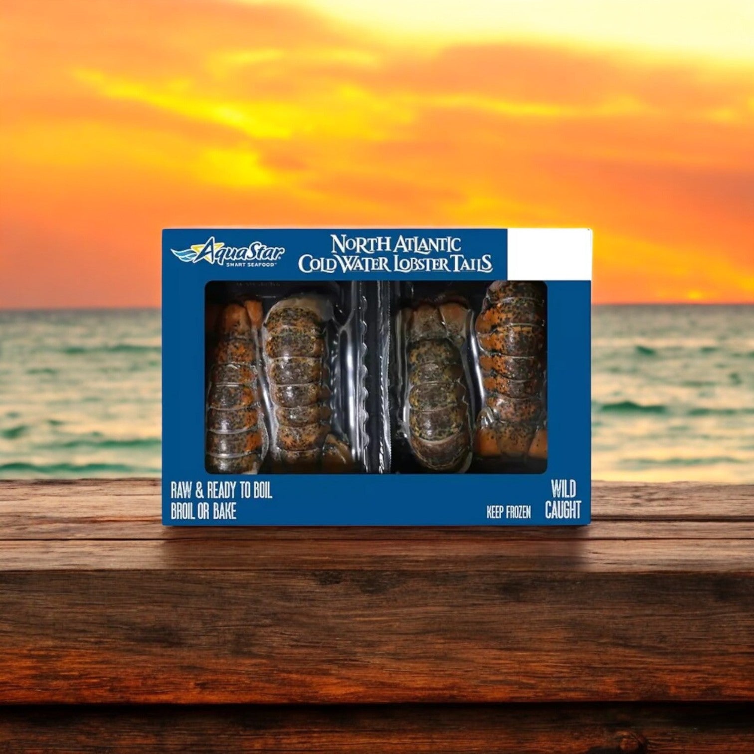An Easy Lunches Crab and Lobster 2 Pack Seafood Feast Combo rests on a wooden surface, setting the scene for a sumptuous seafood meal against an ocean sunset backdrop.