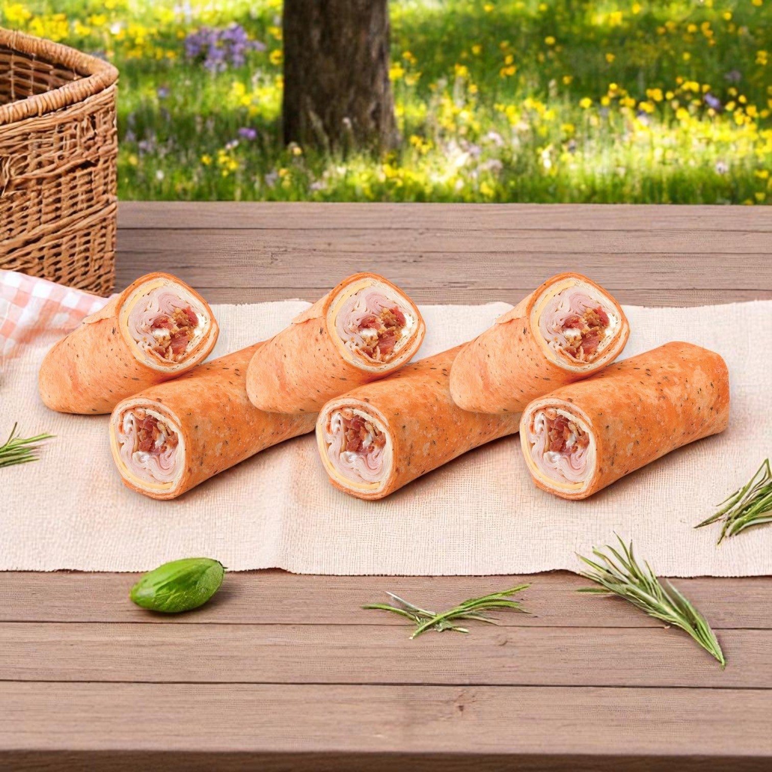 The E.A. Sween 10-Pack Wrap & Sub Sandwich Bundle with 10 Assorted Snack Chips offers a convenient, grab-and-go meal, perfect for outdoor picnics amid grassy, flower-filled scenery.