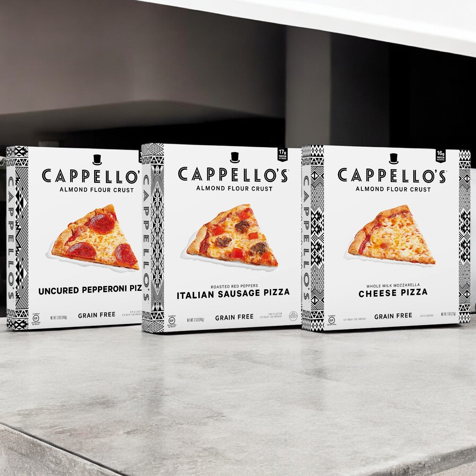 Displayed are three boxes from Cappello's 3 Pack Pizza Combo: pepperoni, Italian sausage, and cheese. Made with Non-GMO ingredients, this set provides a delightful culinary experience with every bite.