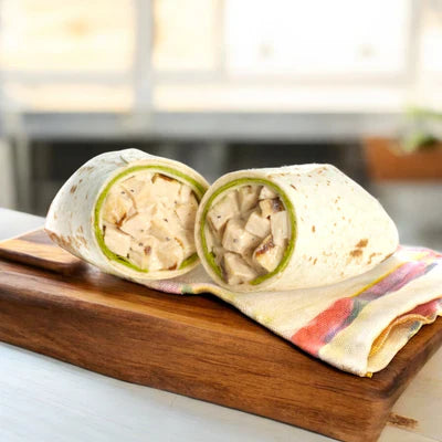 The E.A. Sween Sandwich Combo 5 Items, a frozen variety pack with a 30-day cooler shelf life, is perfect for those seeking premium grab-and-go options like wraps with diced chicken and greens.