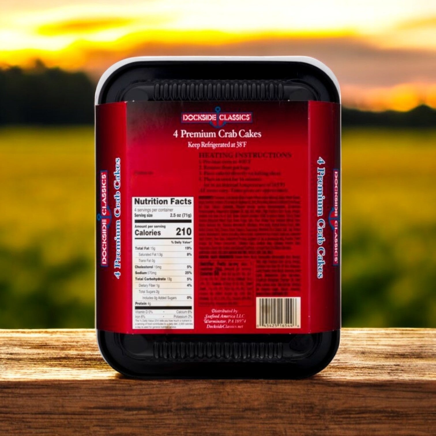 Pack of four Dockside Classics Gourmet Crab Cakes, made with premium ingredients. Nutrition facts are prominently displayed against a blurred outdoor background.