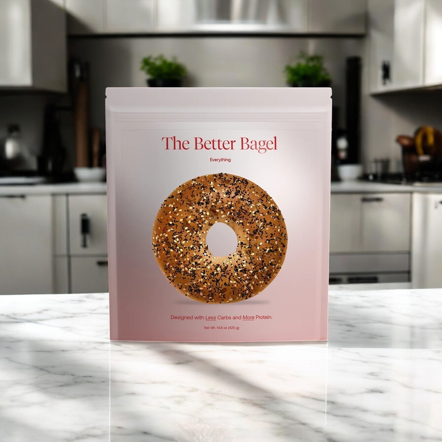 A package of BetterBrand's "The Everything Better Bagel" (1 bag, 4 total bagels) rests on a marble countertop in a modern kitchen. This savory spice blend promises an unforgettable flavor experience.