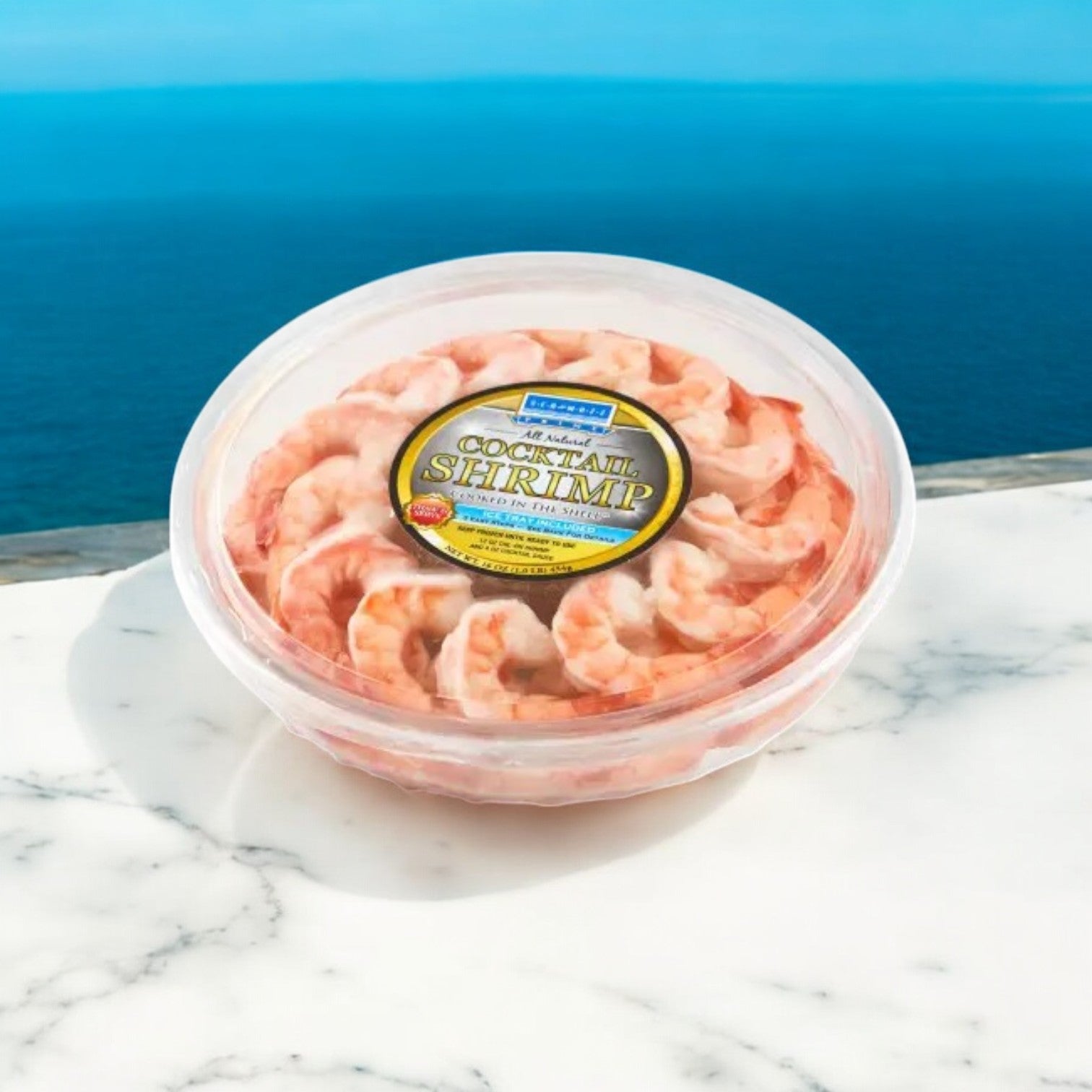A Sea Mazz Shrimp Platter sits elegantly on the marble, set against a stunning ocean view, displaying its fully cooked charm.