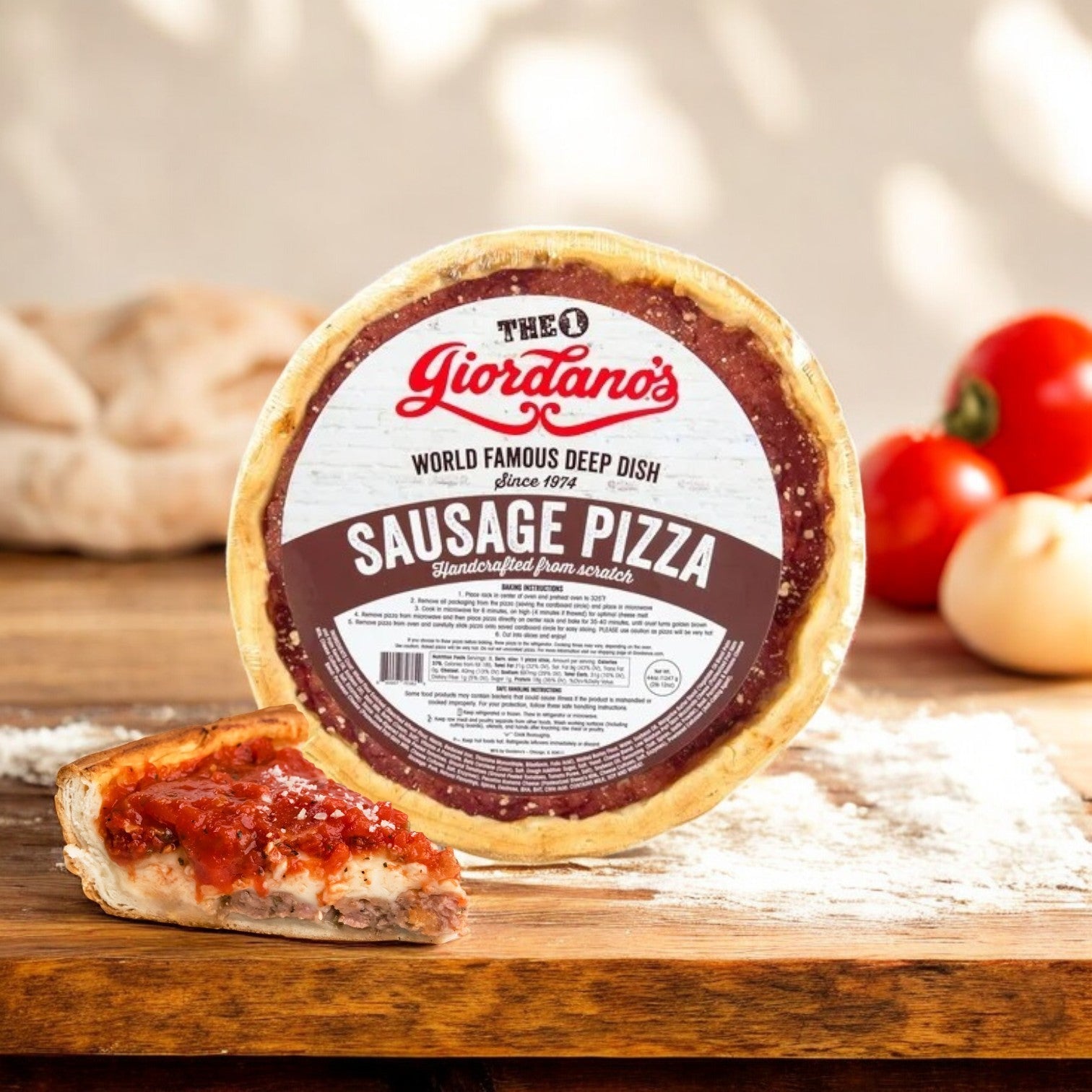 Giordano's Frozen Deep Dish Stuffed Sausage Pizza, a 10" delight from Giordano's, rests on a wooden surface with a slice in front, accompanied by flour, tomatoes, and dough.