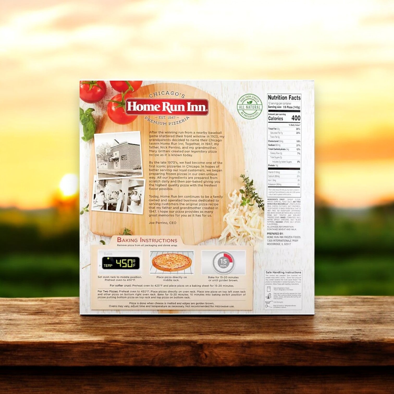 The back of a Home Run Inn Combo! 4 Total Pizzas! box shows baking instructions, nutrition facts, and company history on a wooden surface with a blurred outdoor backdrop.