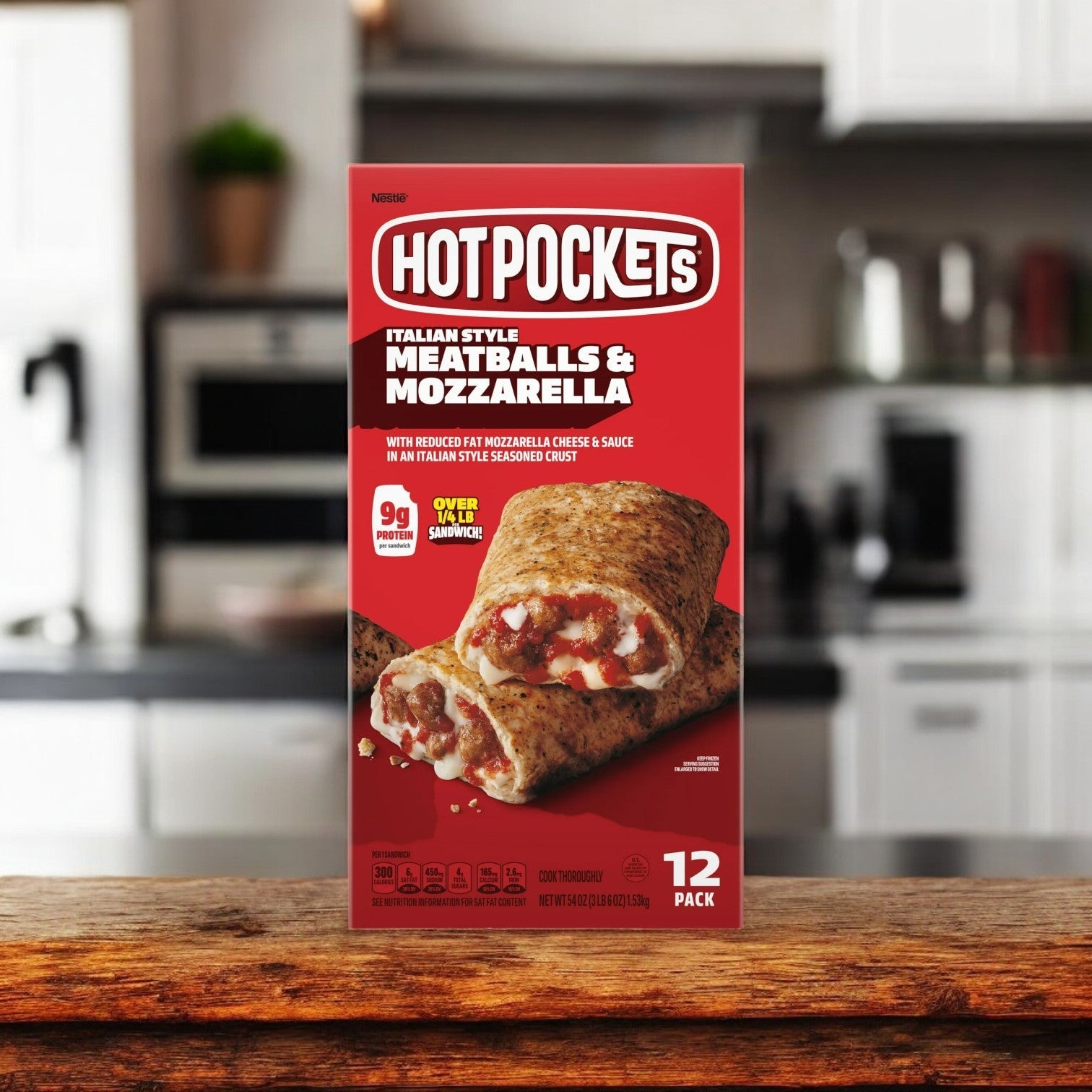 A Hot Pockets Bundle Pack, featuring 9 total boxes, sits invitingly on the kitchen counter, surrounded by a gentle blur—perfect for those seeking delicious frozen snacks to enjoy anytime.