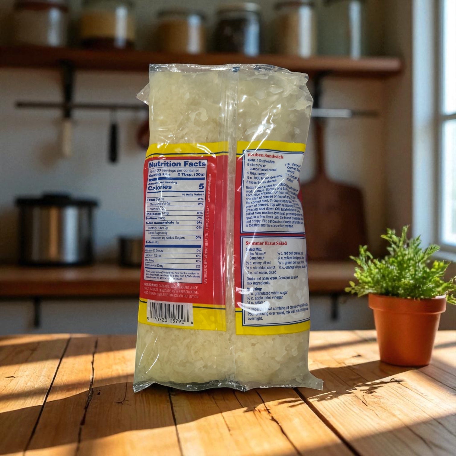 A 32 oz bag of Vienna Beef Sauerkraut stands on a sunlit kitchen table with nutrition facts visible on the packaging. A small potted plant sits nearby.