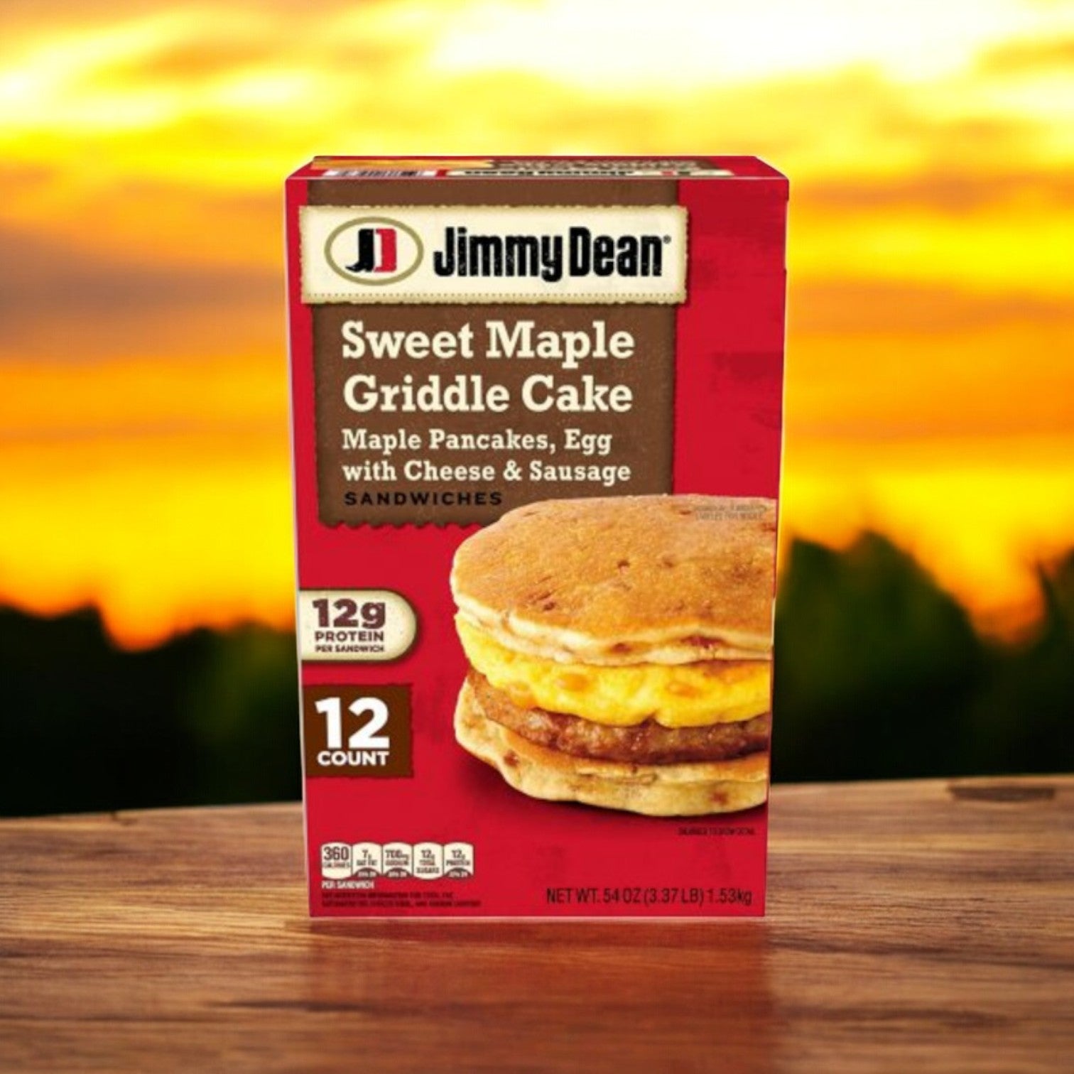 A box of Jimmy Dean Sweet Maple Griddle Cake Breakfast Sandwiches sits on wood, featuring savory sausage between maple pancakes, egg, and cheese. With 12 servings and 12g protein each, they offer the perfect morning treat.