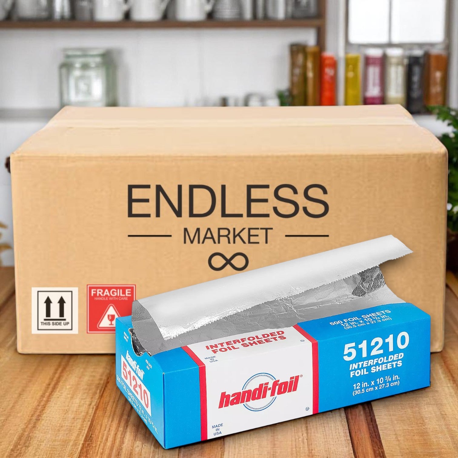 A box of Handi-Foil of America HFA Pre-Cut Foil Sheets, 12" x 10.75", 500 ct (51210), sits open on a wooden surface with an "Endless Market" box behind it—ideal for foodservice use.