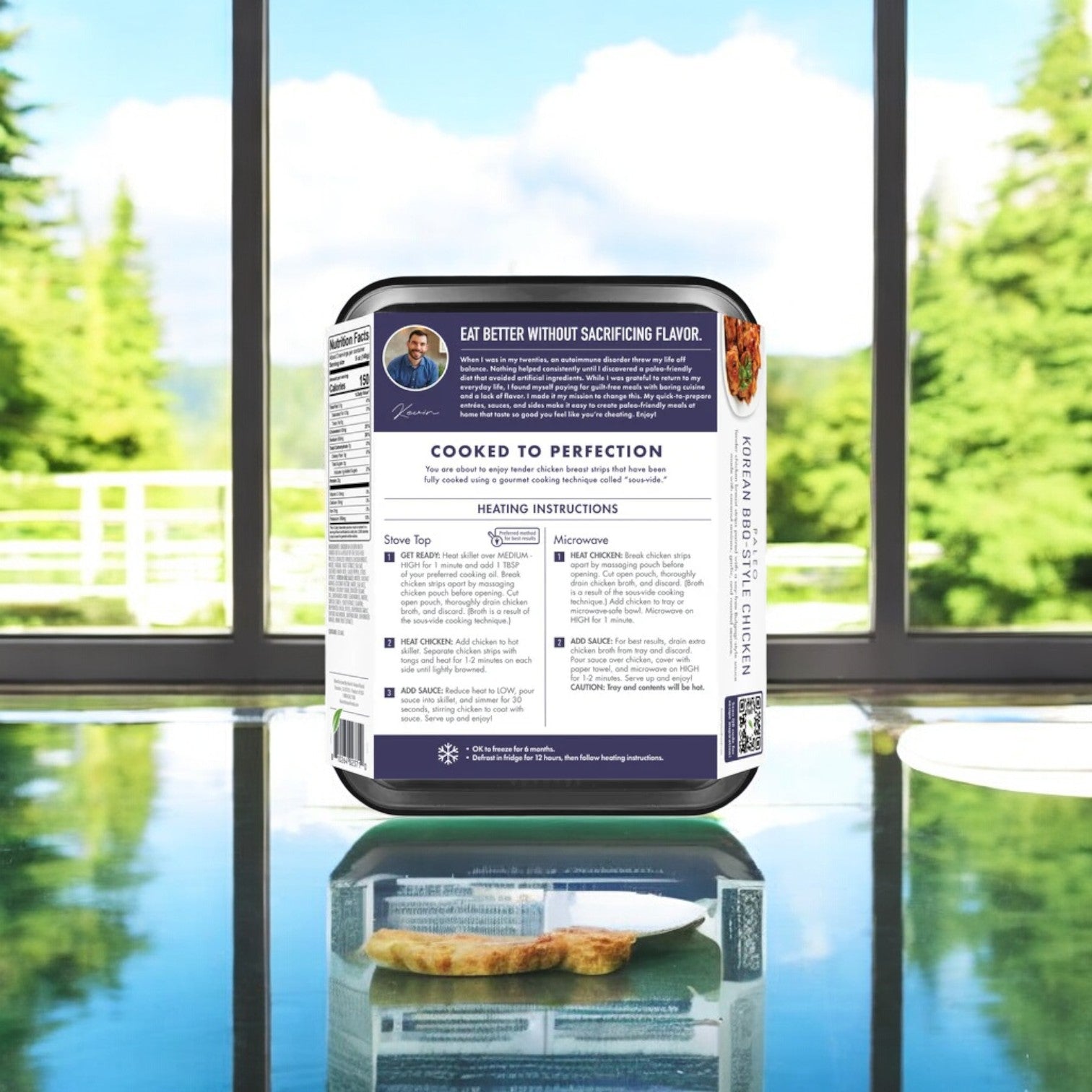 A case of Kevin's Korean BBQ-Style Beef, 16 oz., sits with detailed heating instructions on a glass table, set against a backdrop of trees and a large window.