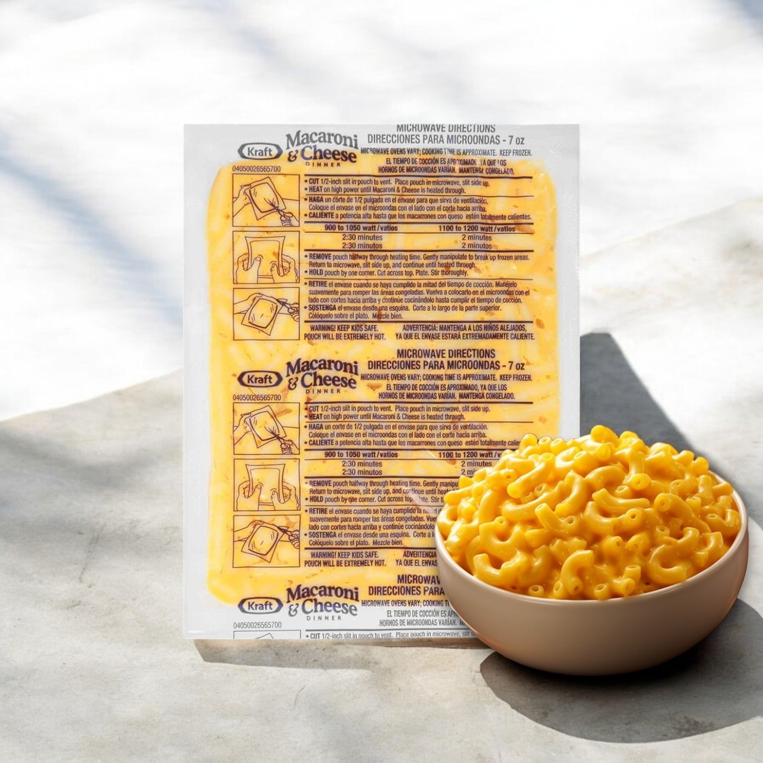 Back view of a Kraft Frozen Entree Macaroni and Cheese package with cooking instructions next to a bowl filled with creamy macaroni and cheese on a wooden surface.