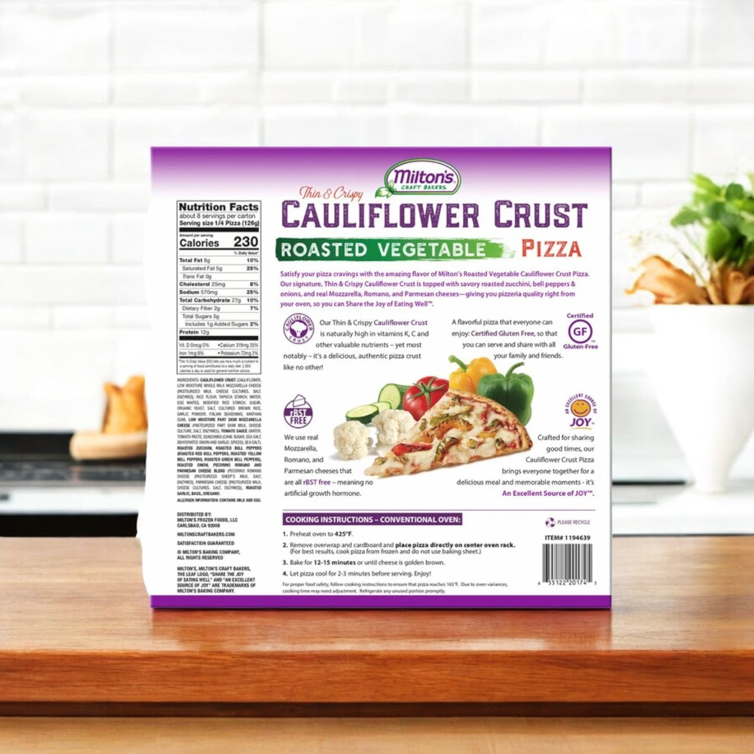 A box of Milton's Cauliflower Crust Pizza, Roasted Vegetable, rests on a wooden surface, displaying nutritional facts and cooking instructions.