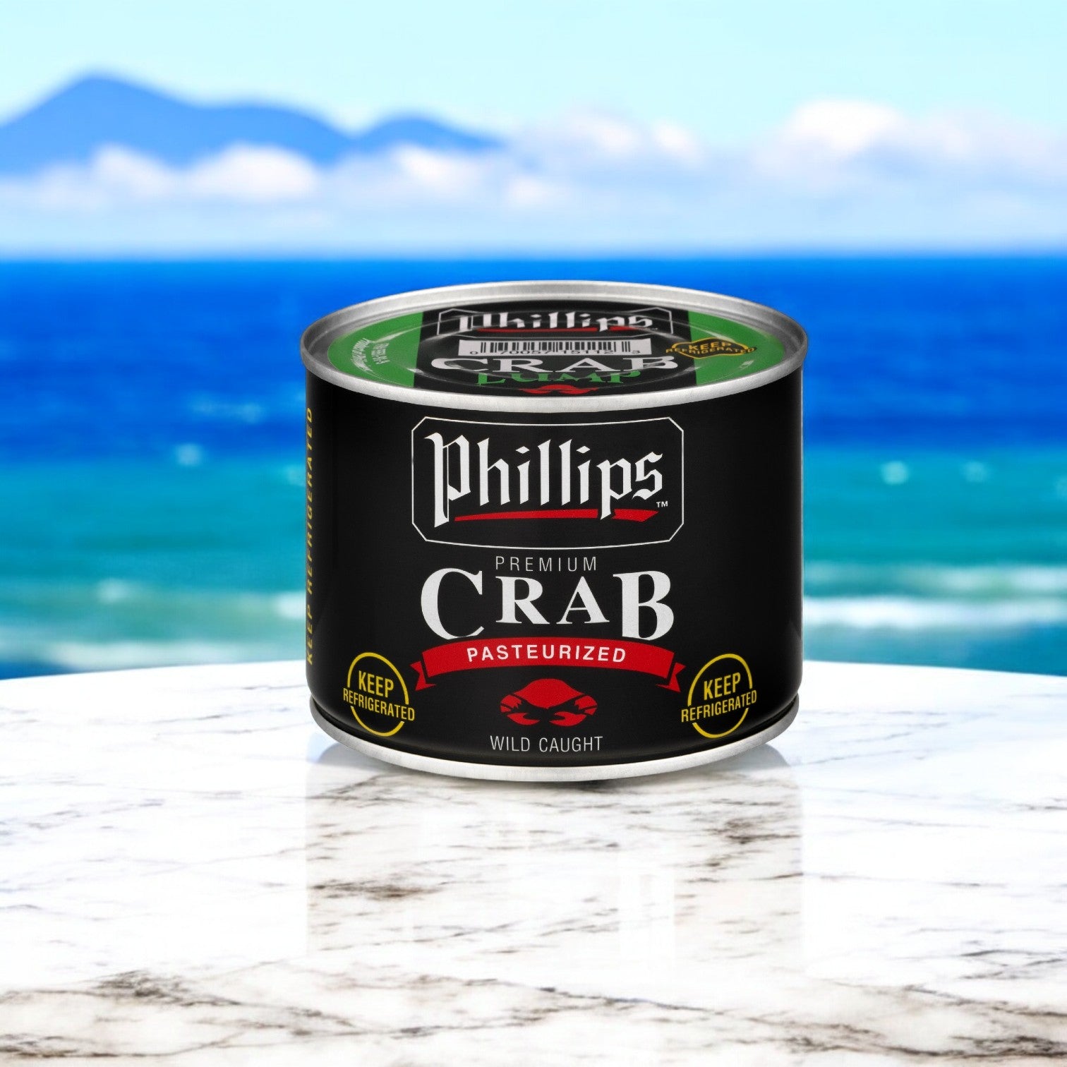 A can of Phillips Foods' premium Southeast Asian crab meat lump sits on a marble surface, against ocean and mountain views, perfect for enhancing seafood dishes.