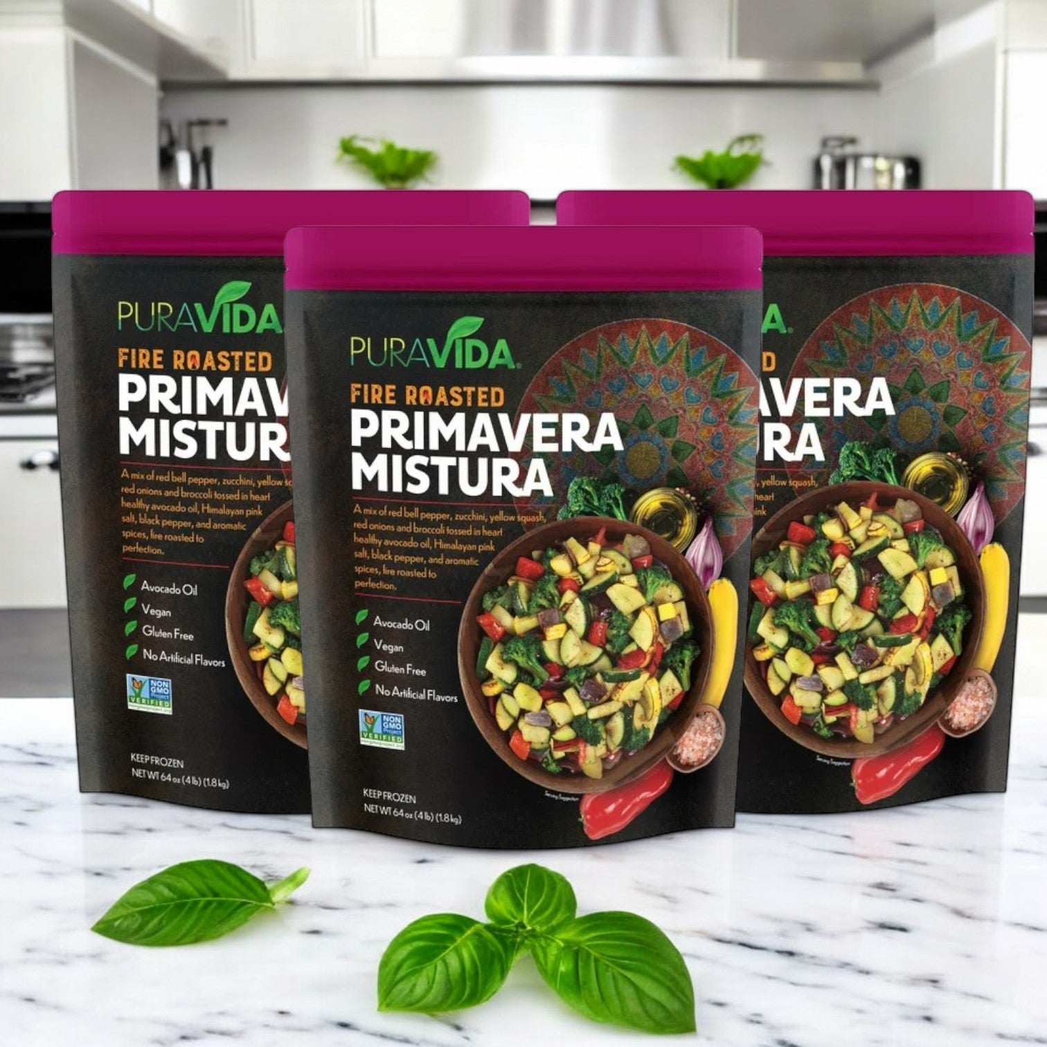 Three packs of Pura Vidaa's 64 oz. Fire Roasted Primavera Mistura are displayed, featuring avocado oil and a smoky flavor. The packaging promotes its vegan, non-GMO, gluten-free qualities, and absence of artificial flavors.