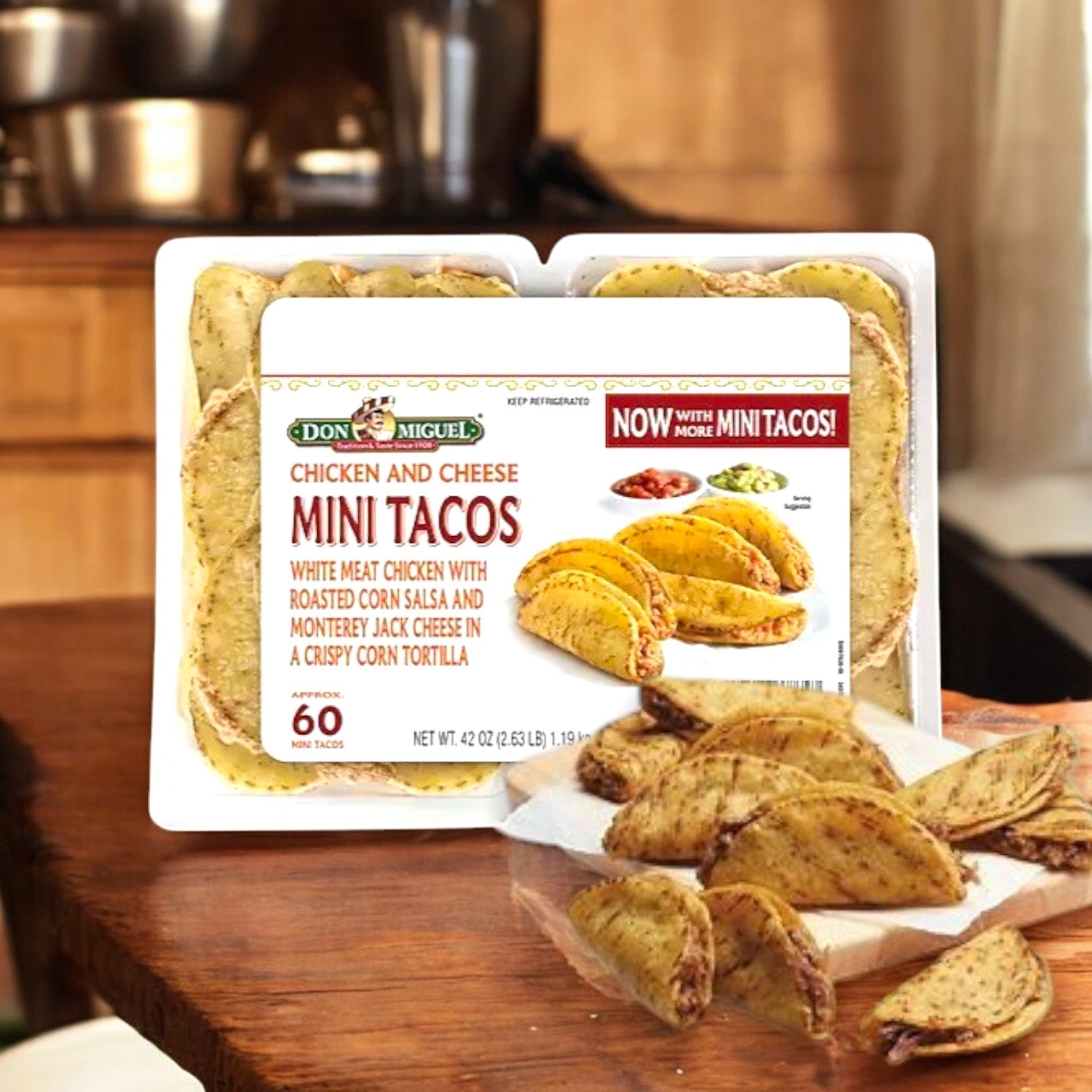 A box of Don Miquel Chicken and Cheese Mini Tacos, 60 count, 1 Case, sits on a kitchen counter with several cooked mini tacos arranged on a plate in front.