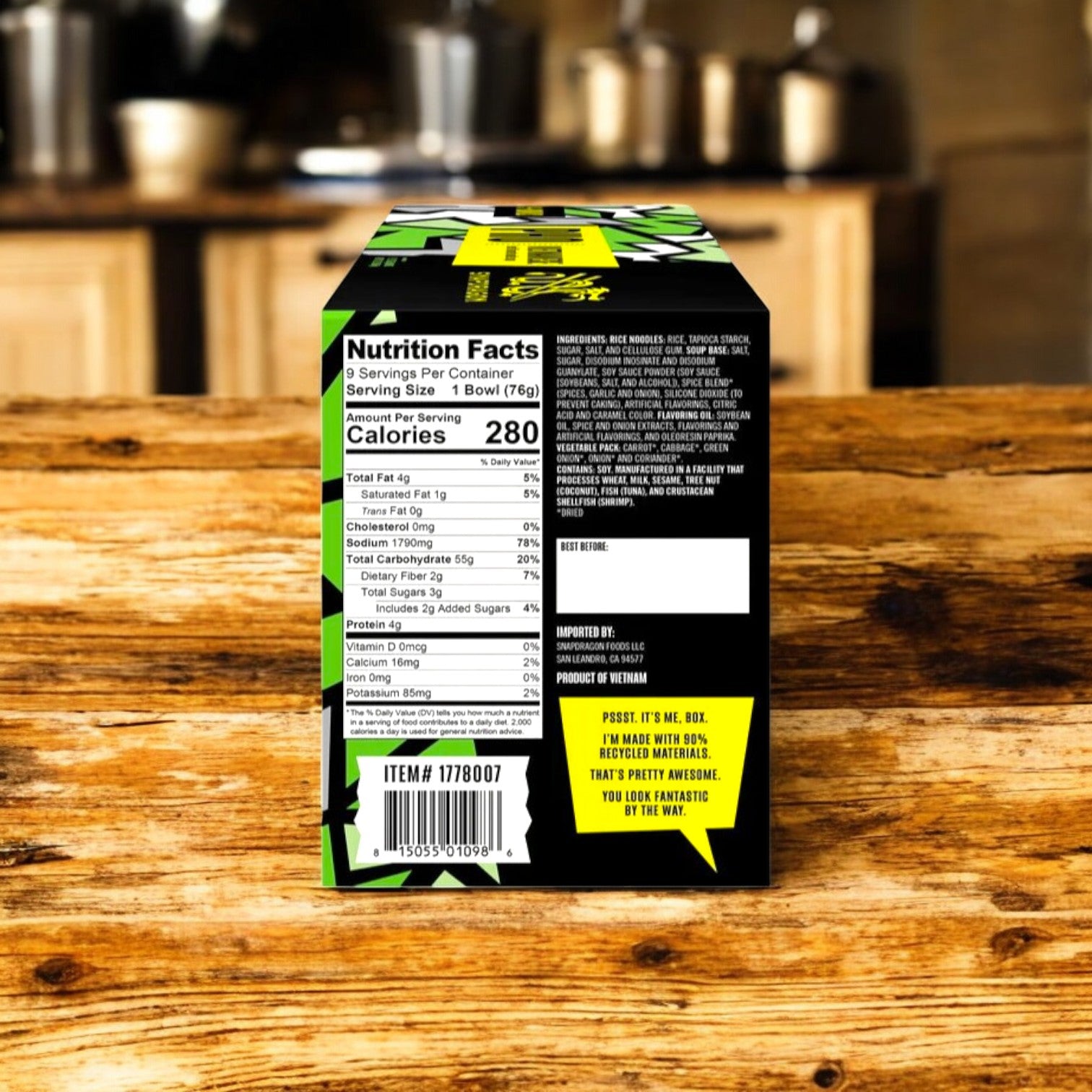 Snapdragon Vietnamese Pho, Beef, presented in black and green packaging with nutrition facts showing 280 calories per serving. The box is on a wooden table against a kitchen background.