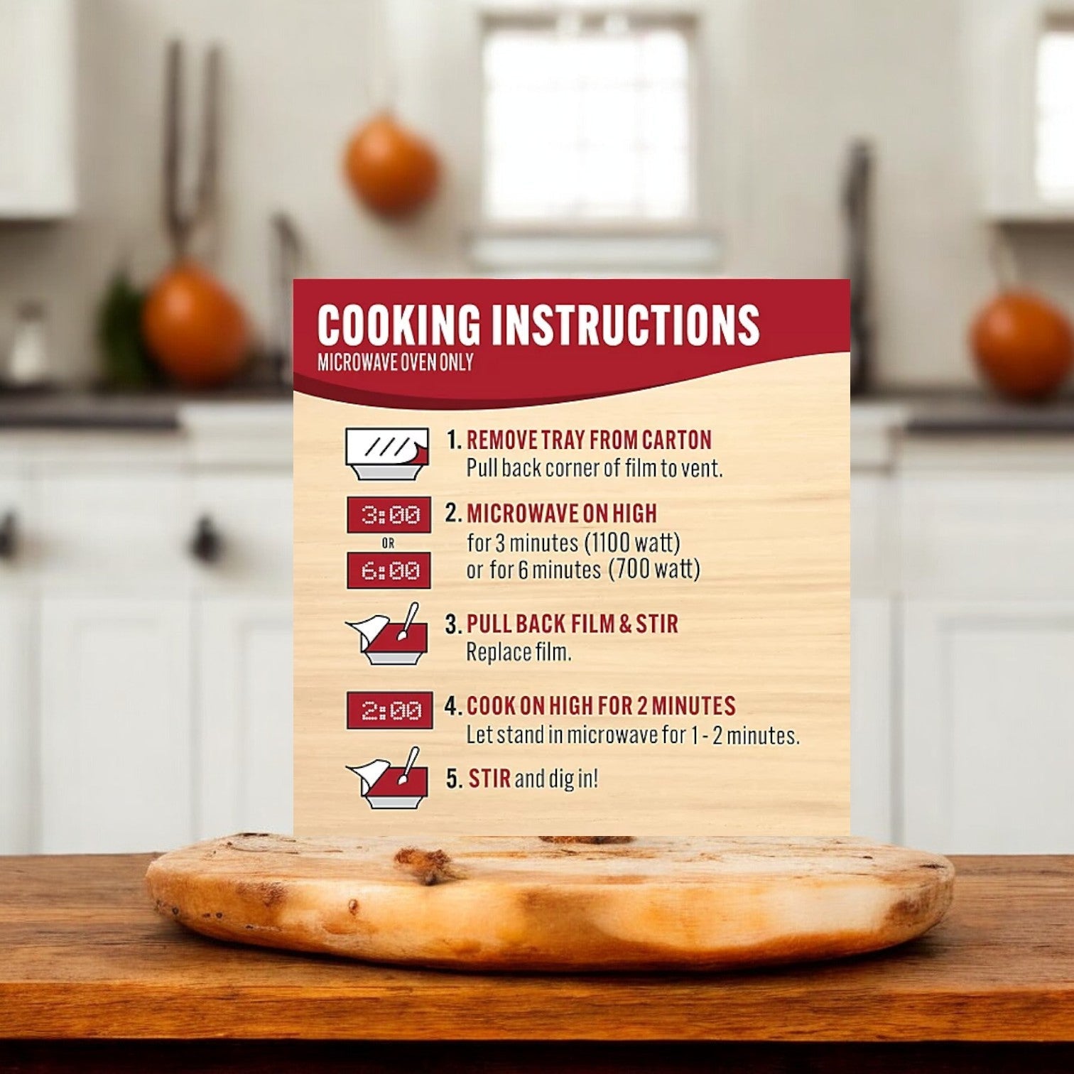 A sign in the kitchen provides cooking instructions for a microwave oven, ideal for a Smart Ones- Weight Watchers® Slow Roasted Turkey Breast with Gravy & Garlic-Herb Mashed Potatoes. Steps include removing the tray, microwaving on high, stirring, cooking further, and letting it stand before stirring again. Perfect for enjoying with Garlic-Herb Mashed Potatoes.