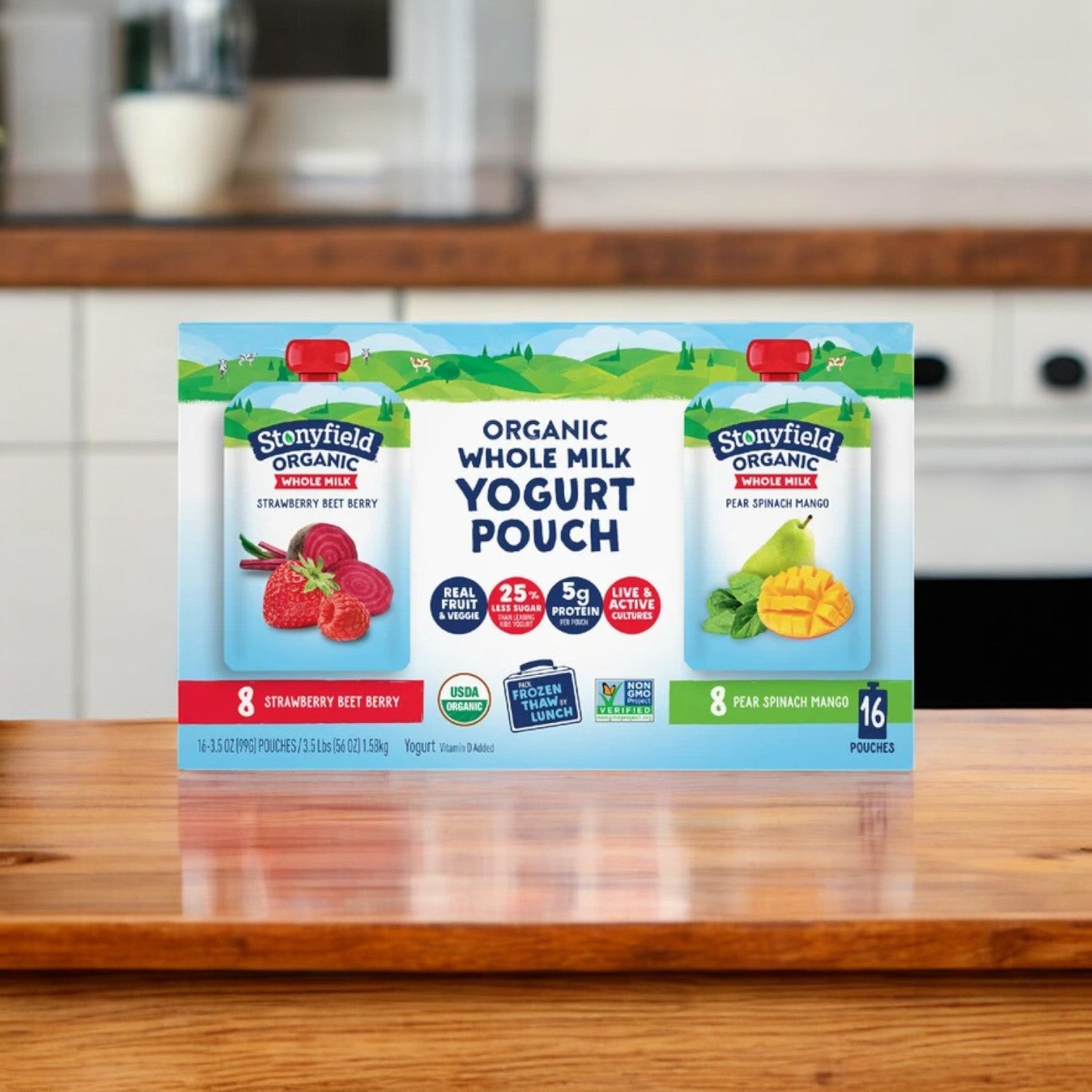 A box of Stonyfield's Organic Yogurt Pouch Variety Pack, showcasing kid-friendly snack flavors such as strawberry beet berry and pear spinach mango, elegantly displayed on a wooden table.
