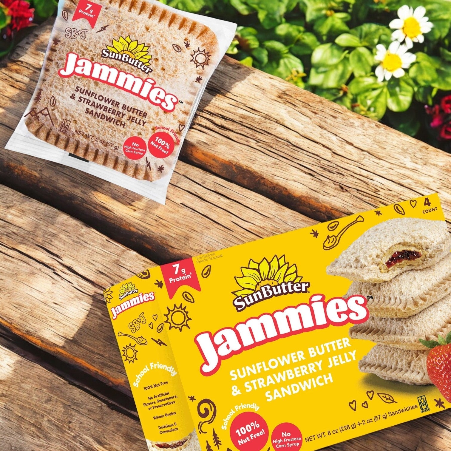 SunButter Sunflower Butter & Strawberry Jelly Sandwich Jammies, made with whole grain bread, are showcased on a wooden surface next to a box emphasizing this delicious allergy-friendly option.