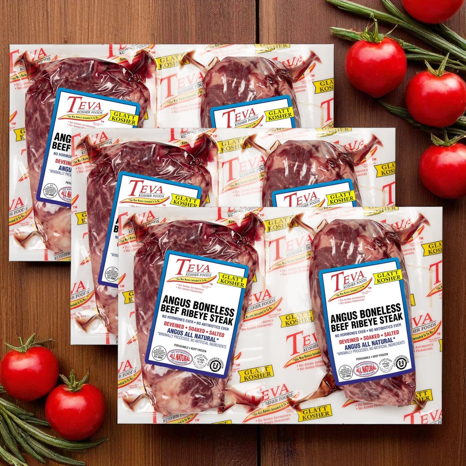 Three packs of Endless Market Teva Glatt Kosher Angus Boneless Ribeye Steak (2-count each) are displayed on a wooden surface, with fresh tomatoes and rosemary sprigs beside them.