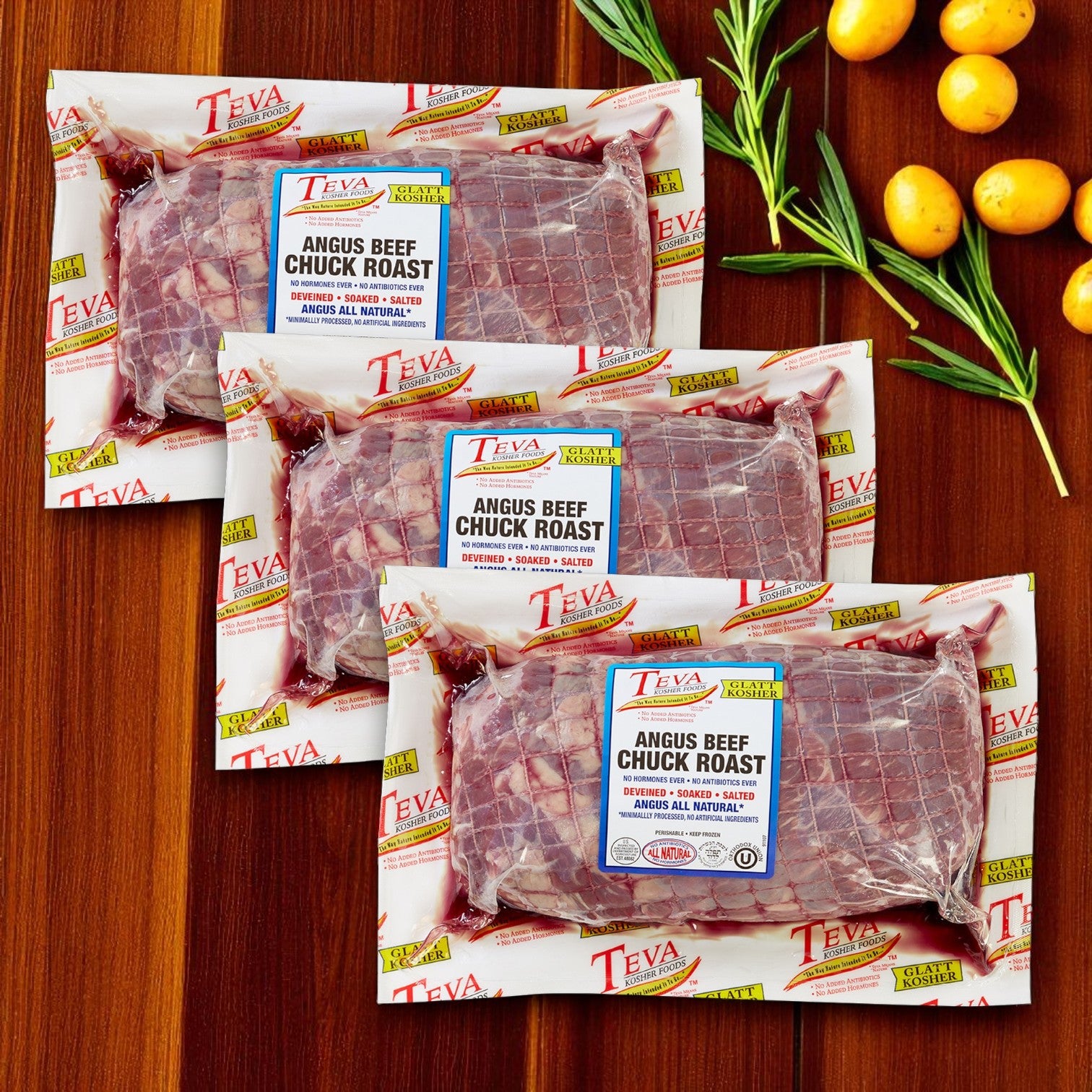 Three vacuum-sealed packs of Endless Market's Teva Kosher Foods Glatt Kosher Angus Beef Chuck Roast (7.5 lb avg. each) are arranged on a wooden surface, with rosemary and yellow tomatoes beside them.