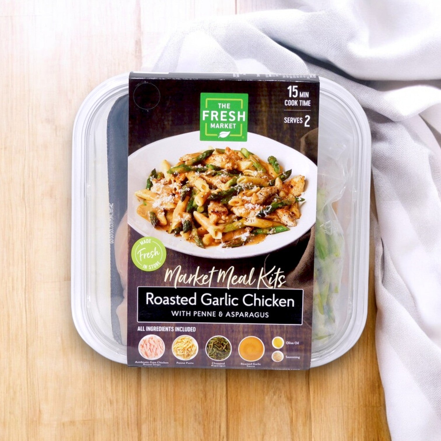 Try The Fresh Market's Roasted Garlic Chicken with Penne & Asparagus Market Meal Kit. This 36 oz product serves two in just 15 minutes, perfect for an easy and delicious home-cooked meal.