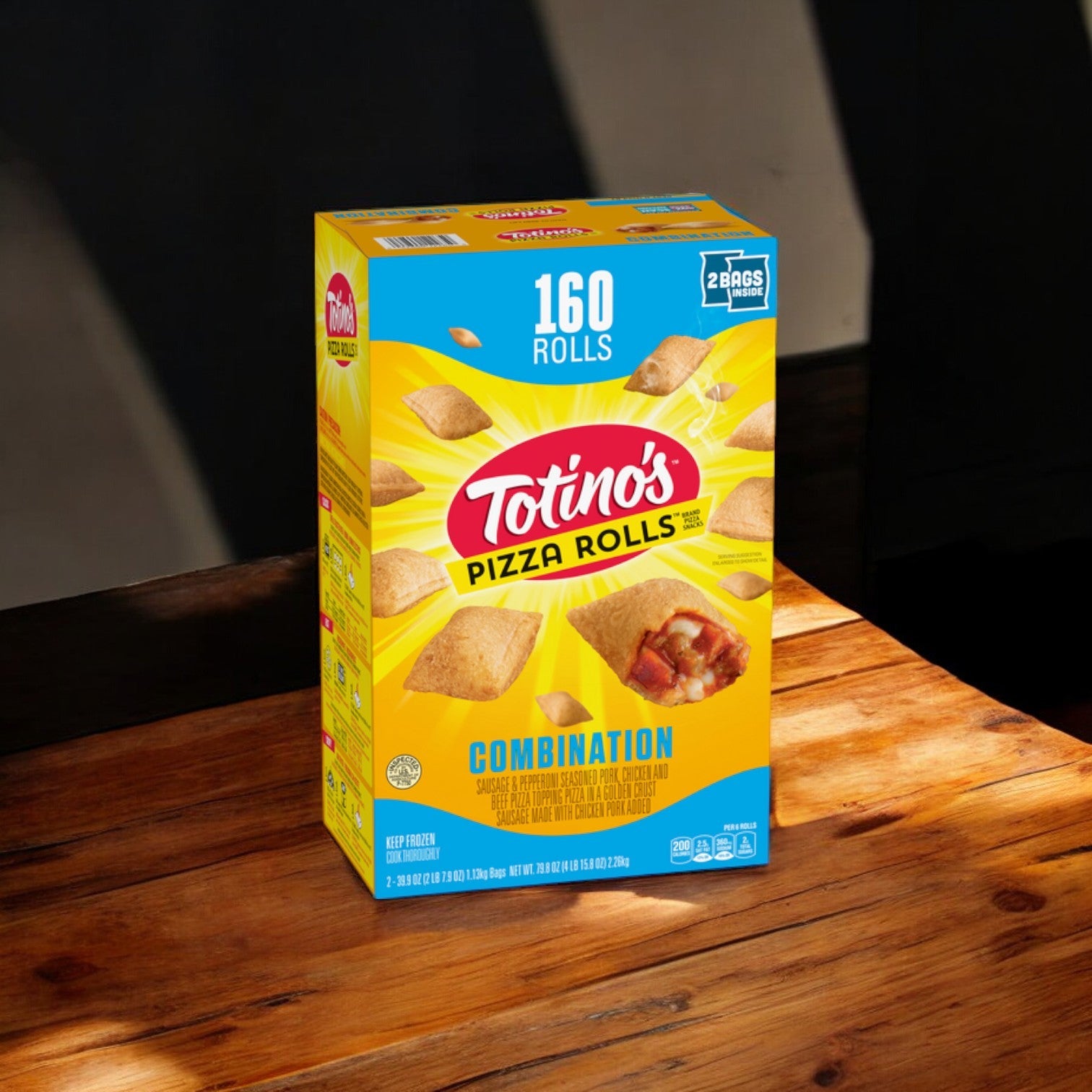 A case of Easy Lunches Totino's Pizza Rolls, Combination, rests on a wooden surface, featuring the mouthwatering Combination Flavor. The 79.8 oz package includes four packs filled with quick and convenient bites to satisfy your cravings instantly.