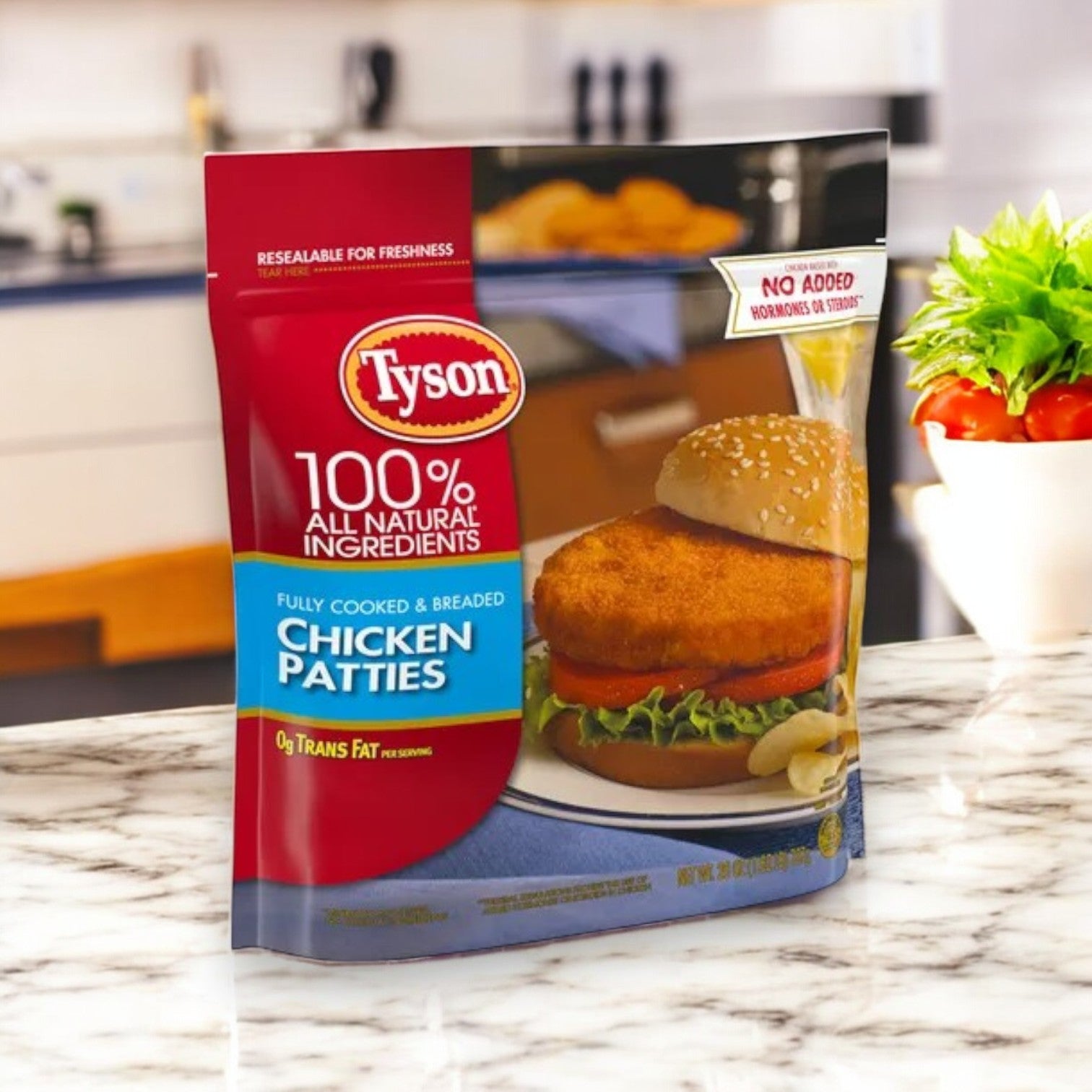 A Tyson Breaded Chicken Patties package, displaying a tasty burger with lettuce, rests on a marble counter. Made from all-white meat and fully cooked, these patties are ideal for a quick meal.