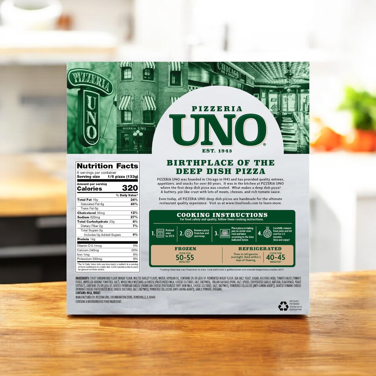 Displayed on a wooden table, the back of a Pizzeria Uno 9 Inch Chicago Style Deep Dish Classic Sausage Pizza box features nutrition facts, cooking instructions, and brand details, promising an authentic deep dish experience akin to the renowned Chicago style.