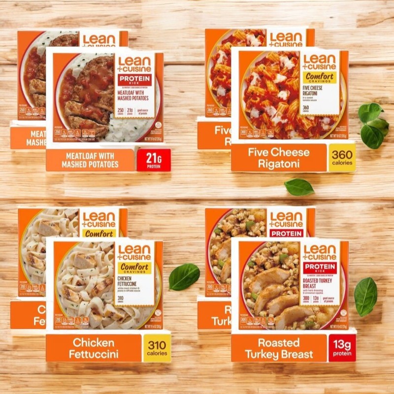 The Lean Cuisine Meal Bundle! 8 Meals! is displayed on a wooden surface, featuring classic favorites like Meatloaf, Five Cheese Rigatoni, Chicken Fettuccini, and Roasted Turkey Breast. Enjoy quick and easy meals by Lean Cuisine for any occasion.