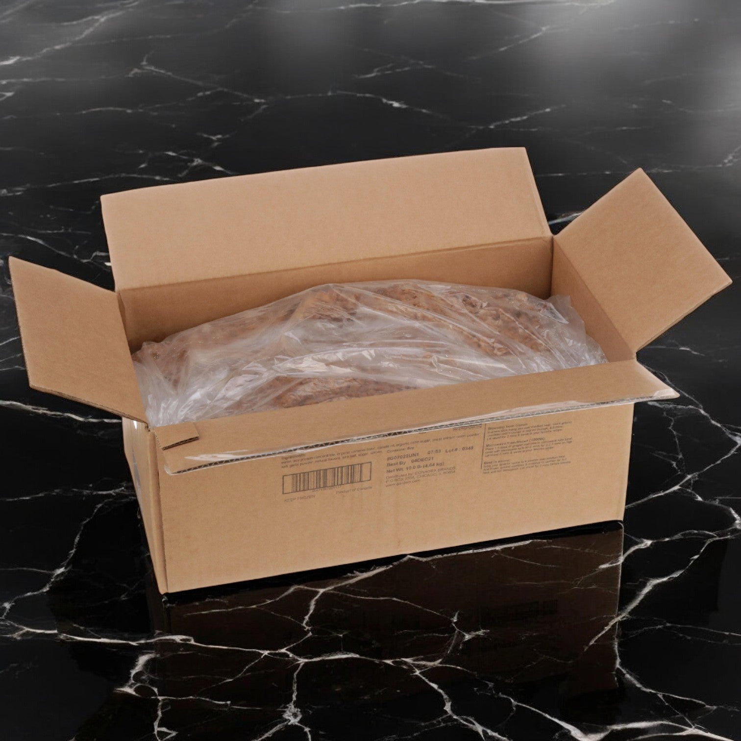 Inside the open box on a black marble surface is a plastic-wrapped bag of Gardein Veggie Burger Vegetarian Soy Ground Crumble, offering gluten-free plant-based protein packed with flavor.