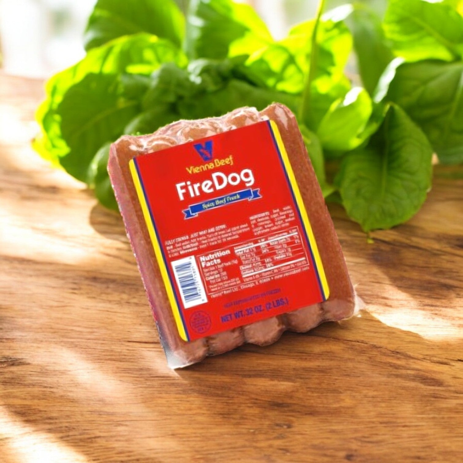 A package of Vienna Beef Variety Pack – A Classic Selection of Chicago’s Finest Sausages! is placed on a wooden surface with green leafy plants in the background.