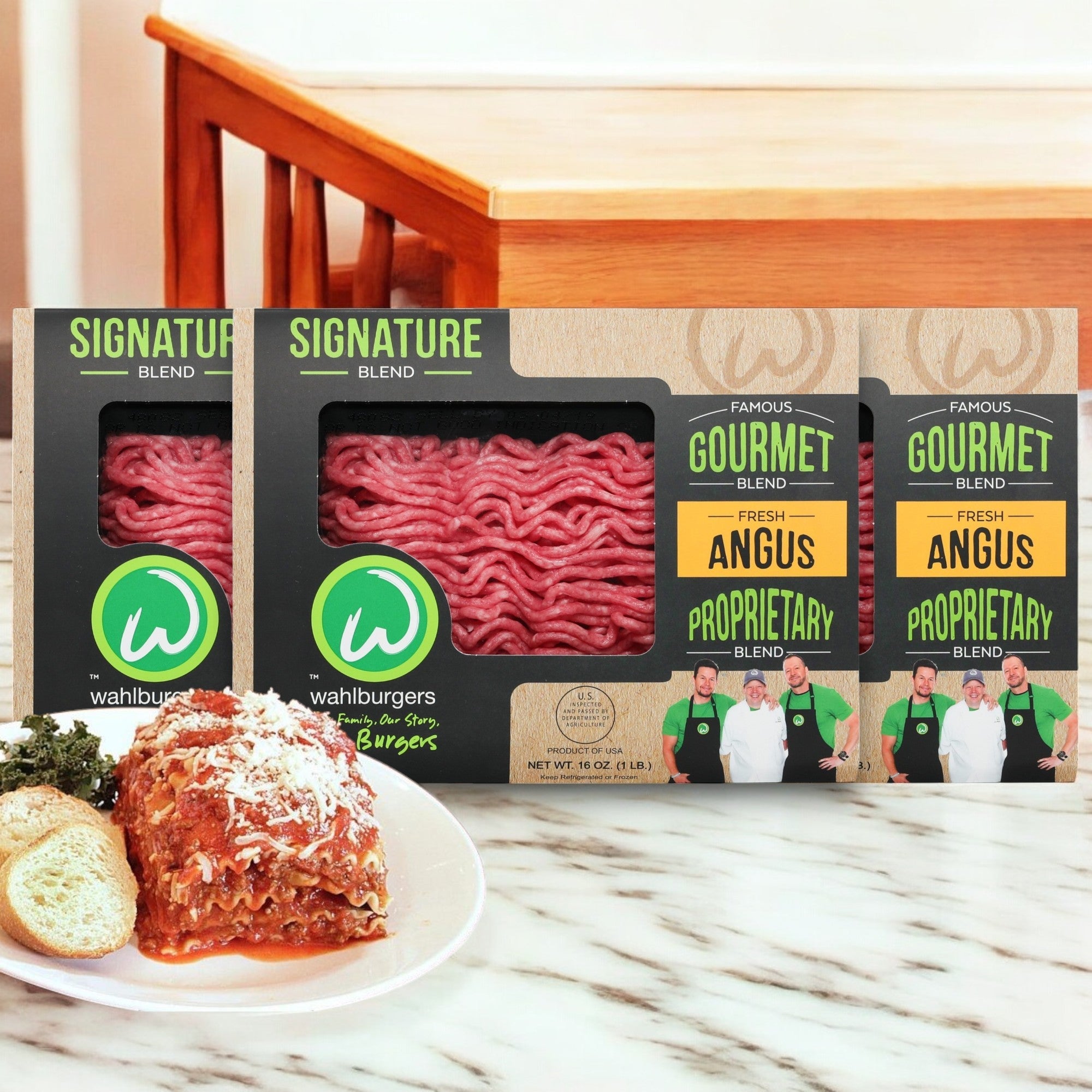 Wahlburgers Signature Blend Loaf, a premium beef and Angus blend, is shown on a kitchen counter beside lasagna.